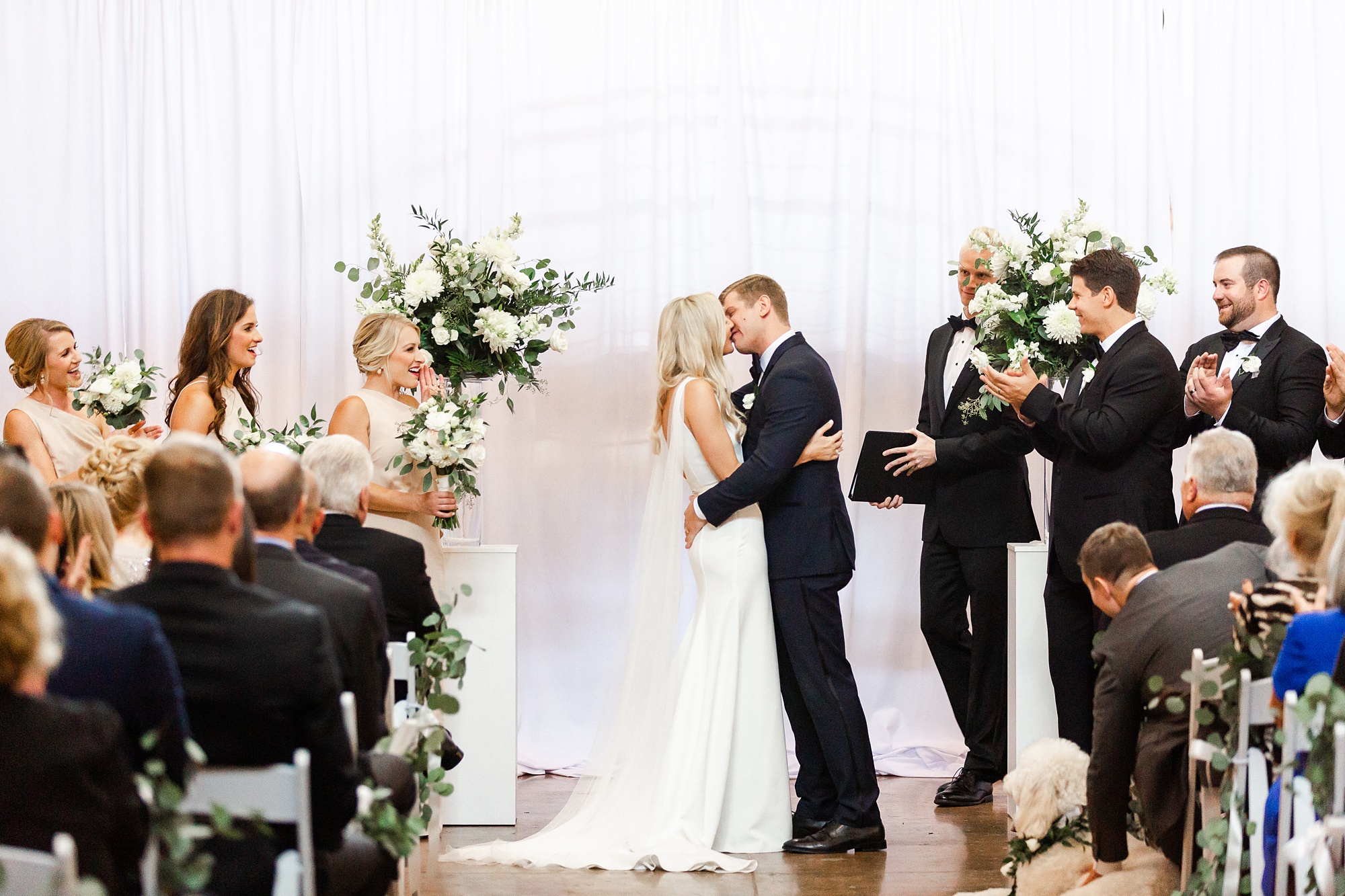 first kiss at Design Center Atrium wedding ceremony