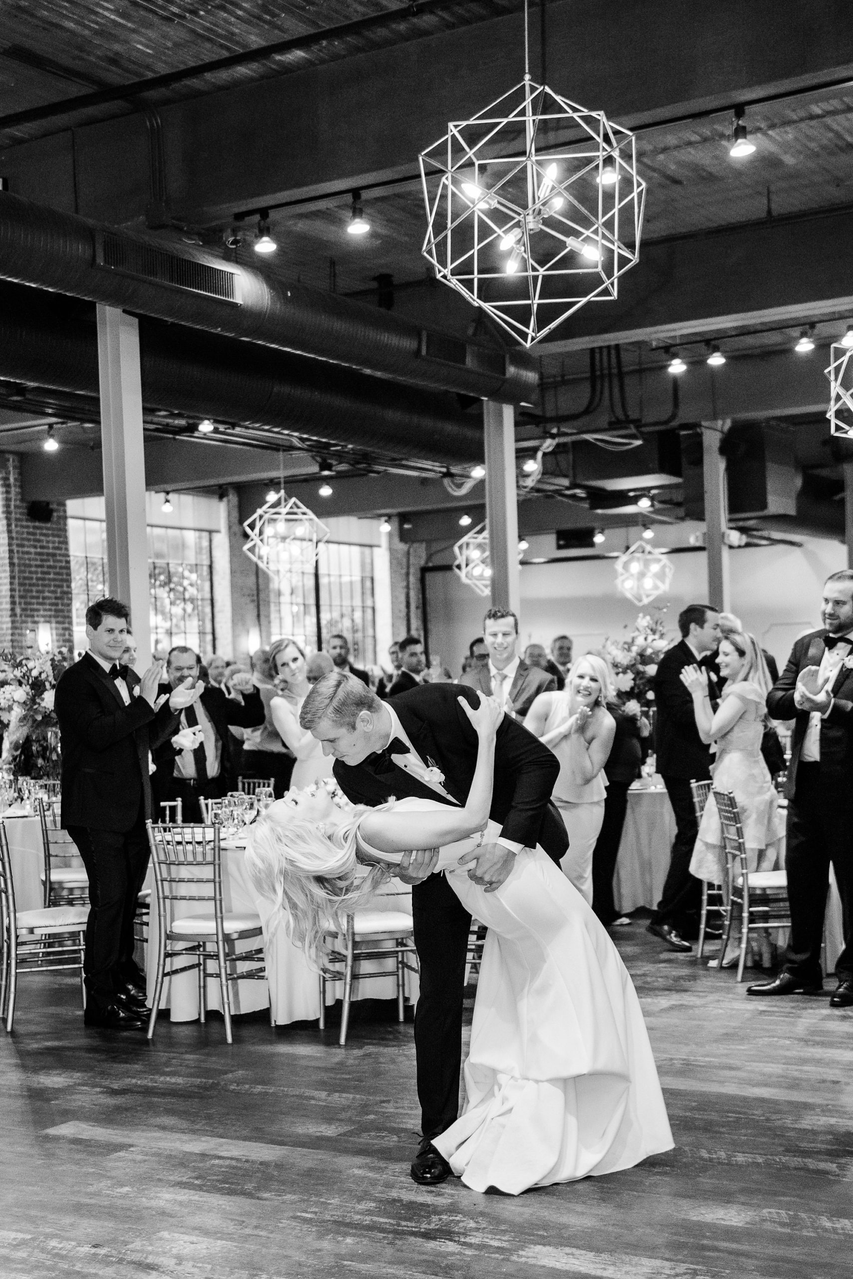 newlyweds kiss during Byron's South End wedding reception