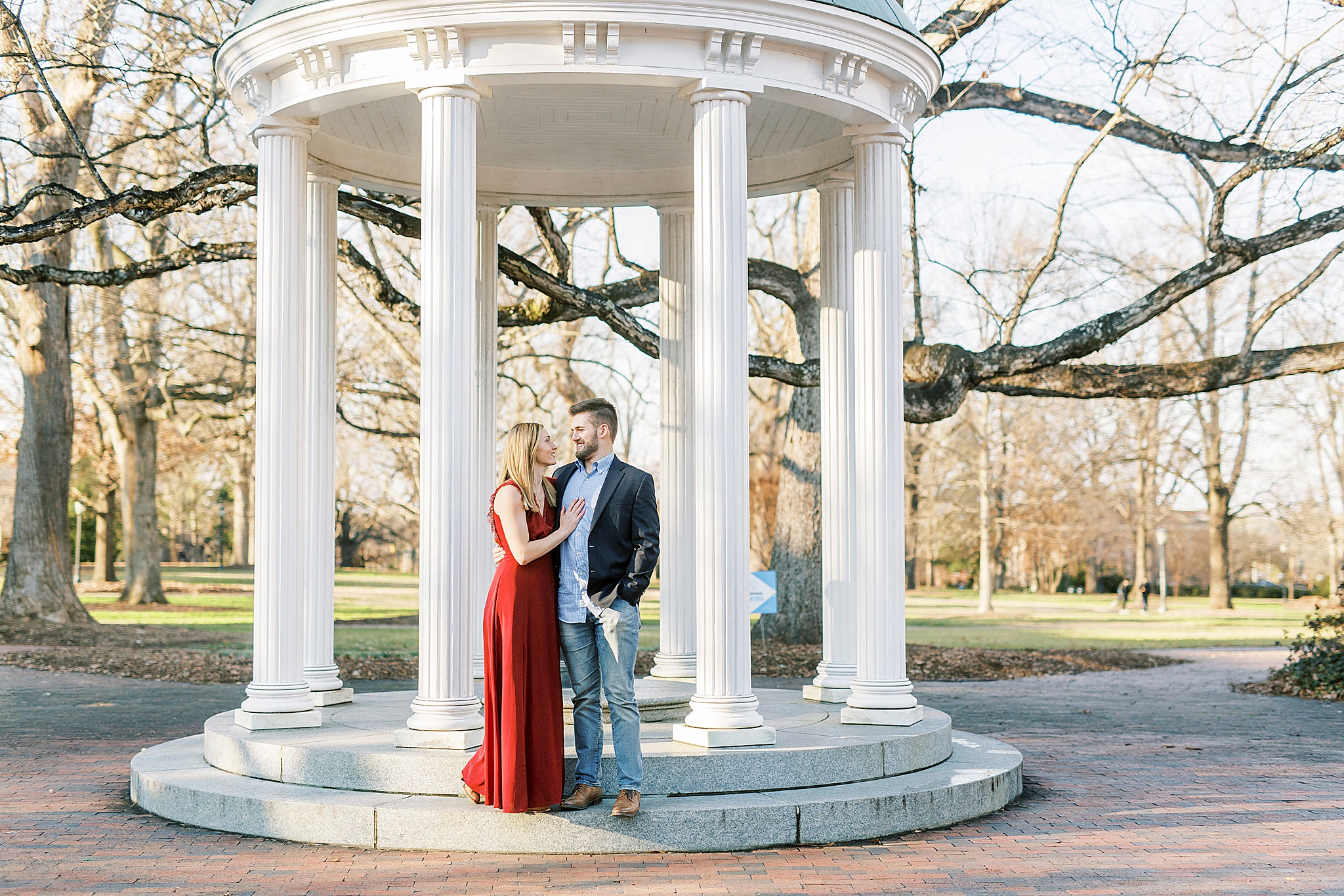bride and groom pose on steps of gazebo