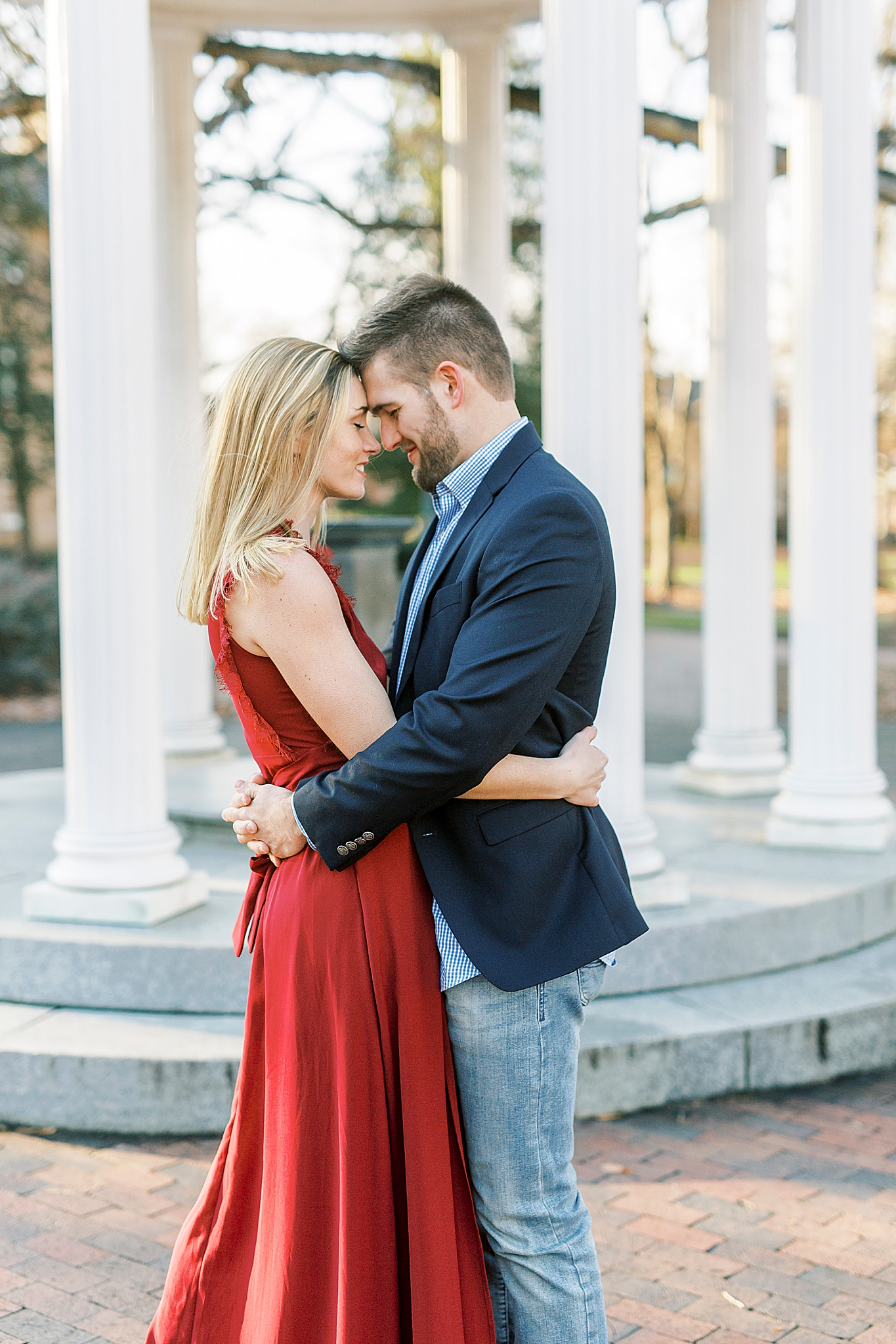 engaged couple stands with foreheads touching during NC engagement photos