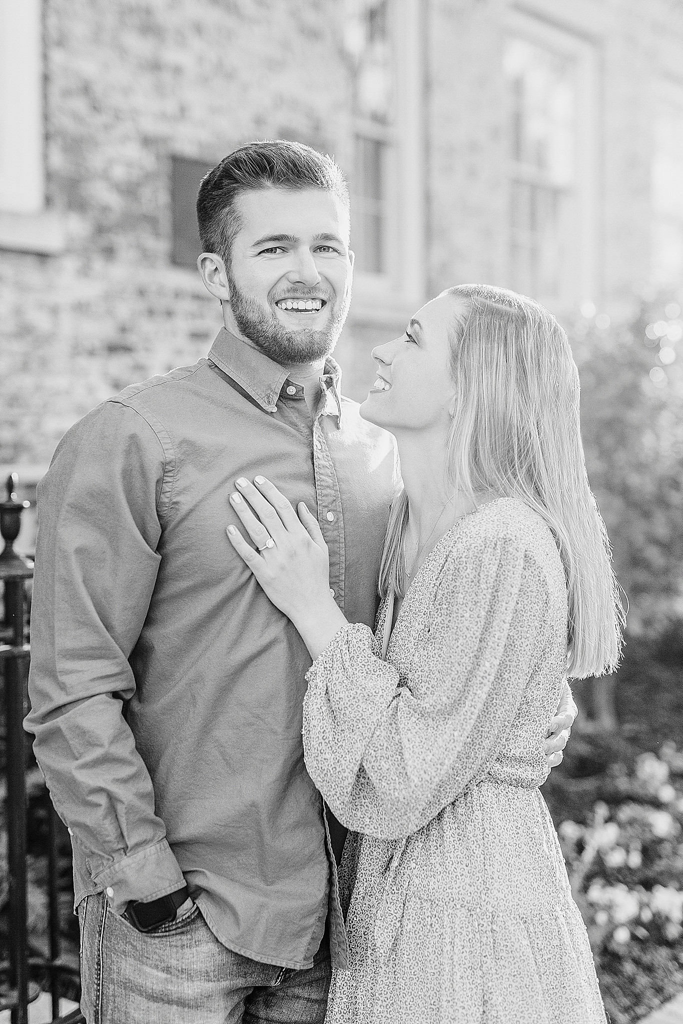 bride laughs at groom during engagement photos at Chapel Hill