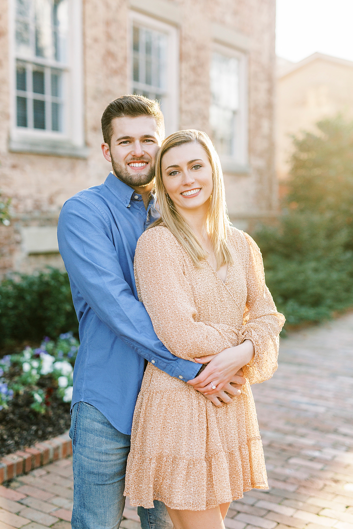 groom hugs bride from behind during NC engagement photos