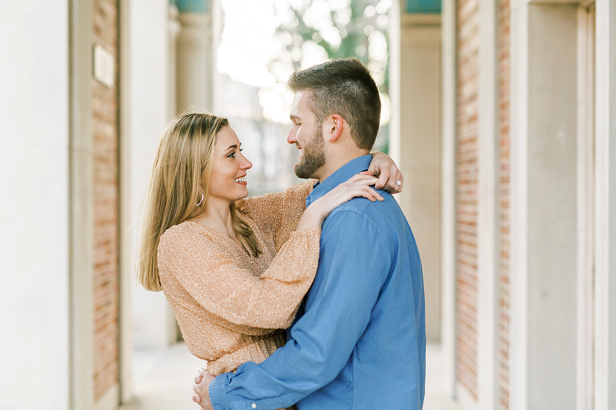 couple hugs in bell tower at UNC Chapel Hill
