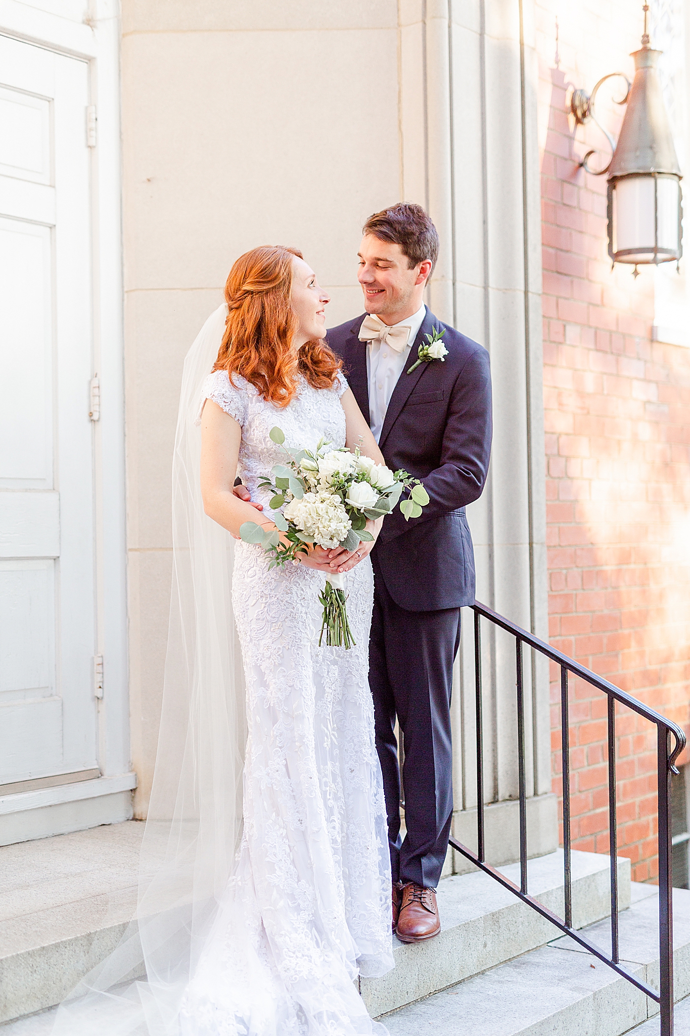 newlyweds pose on church steps in Warrenton NC