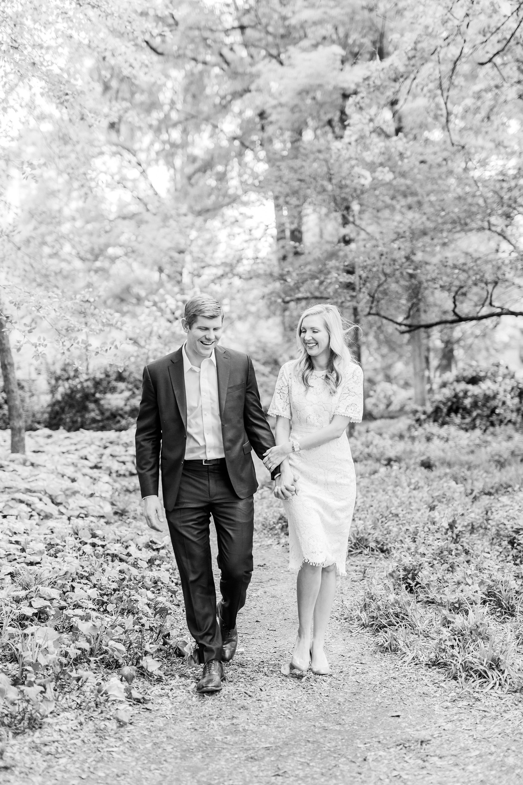 engaged couple walks through Fourth Ward Park