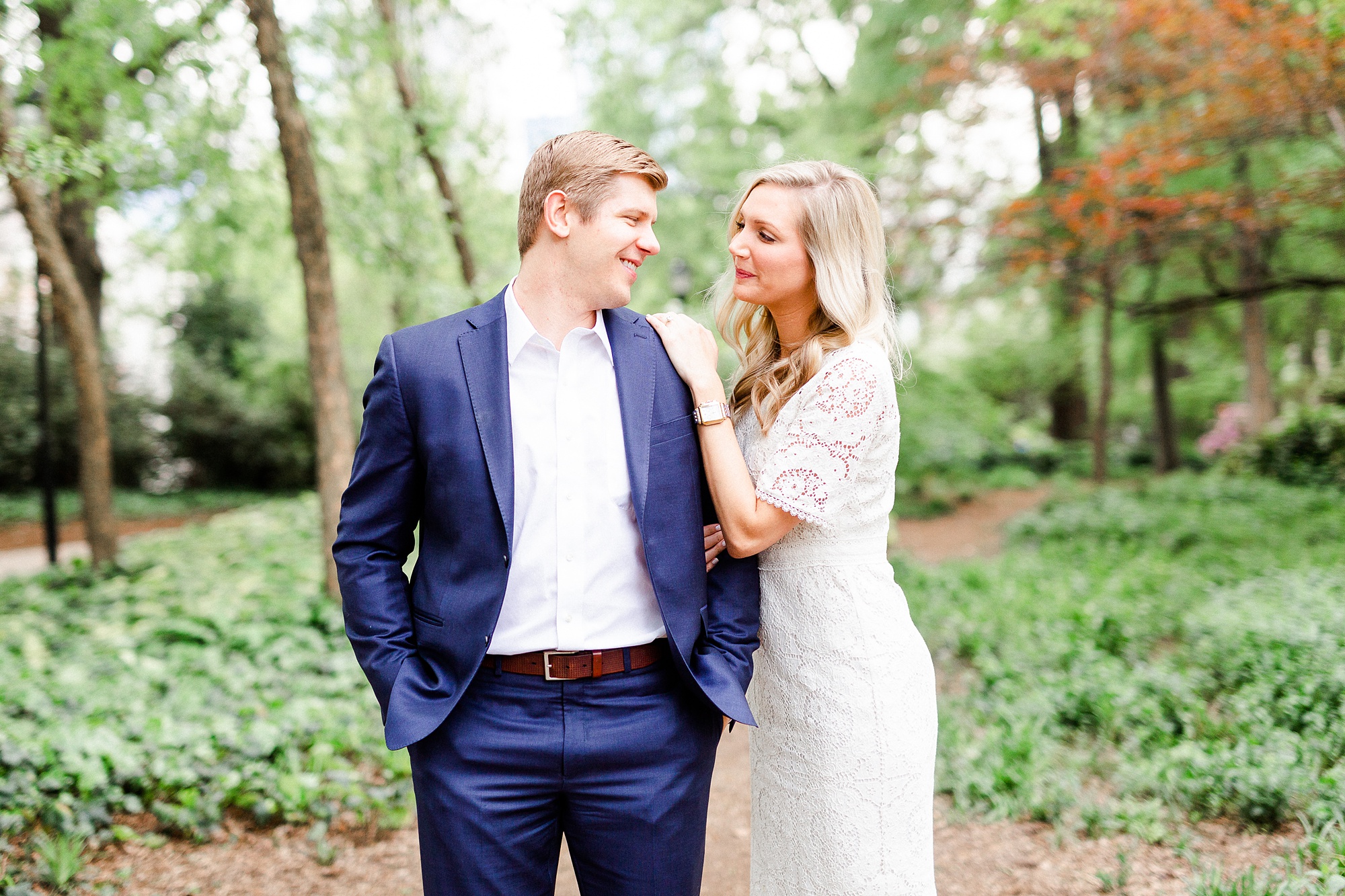 bride and groom pose in gardens of Fourth Ward Park