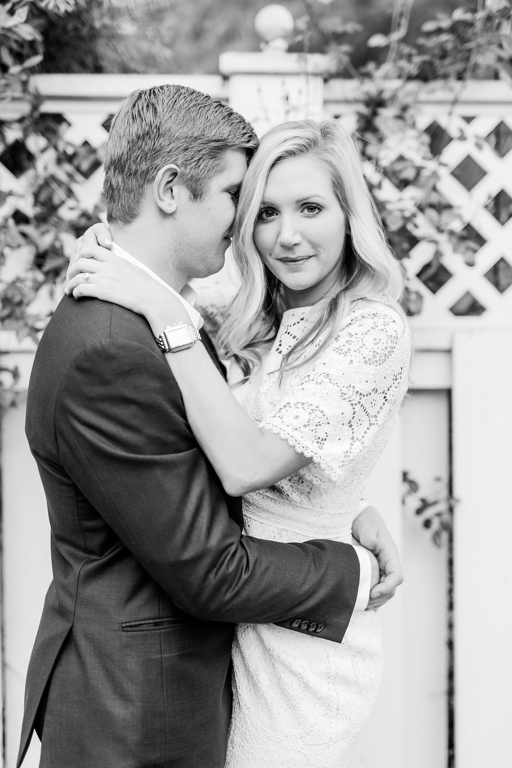 stylish Charlotte engagement photos along white fence