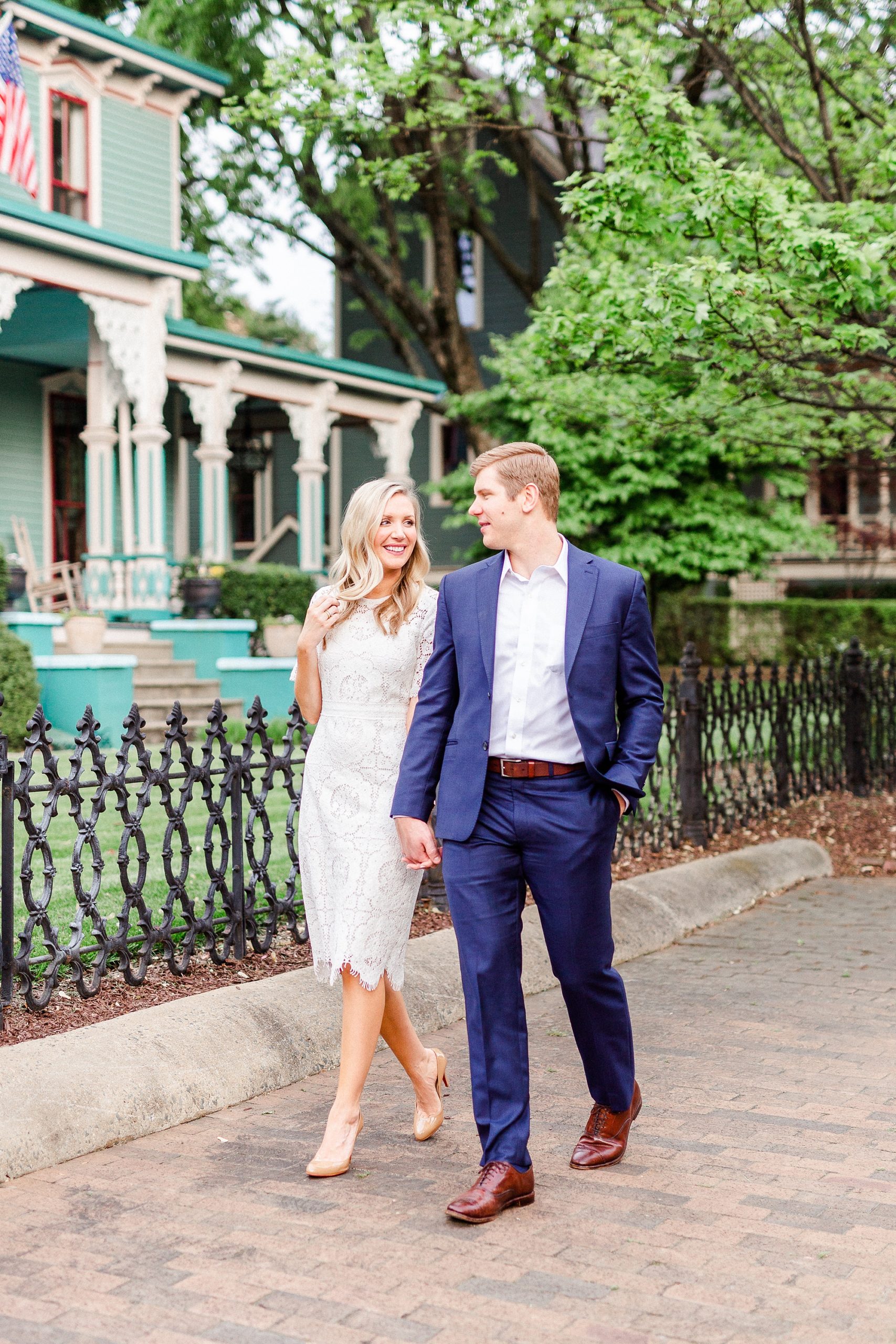 bride and groom walk down street in Uptown Charlotte