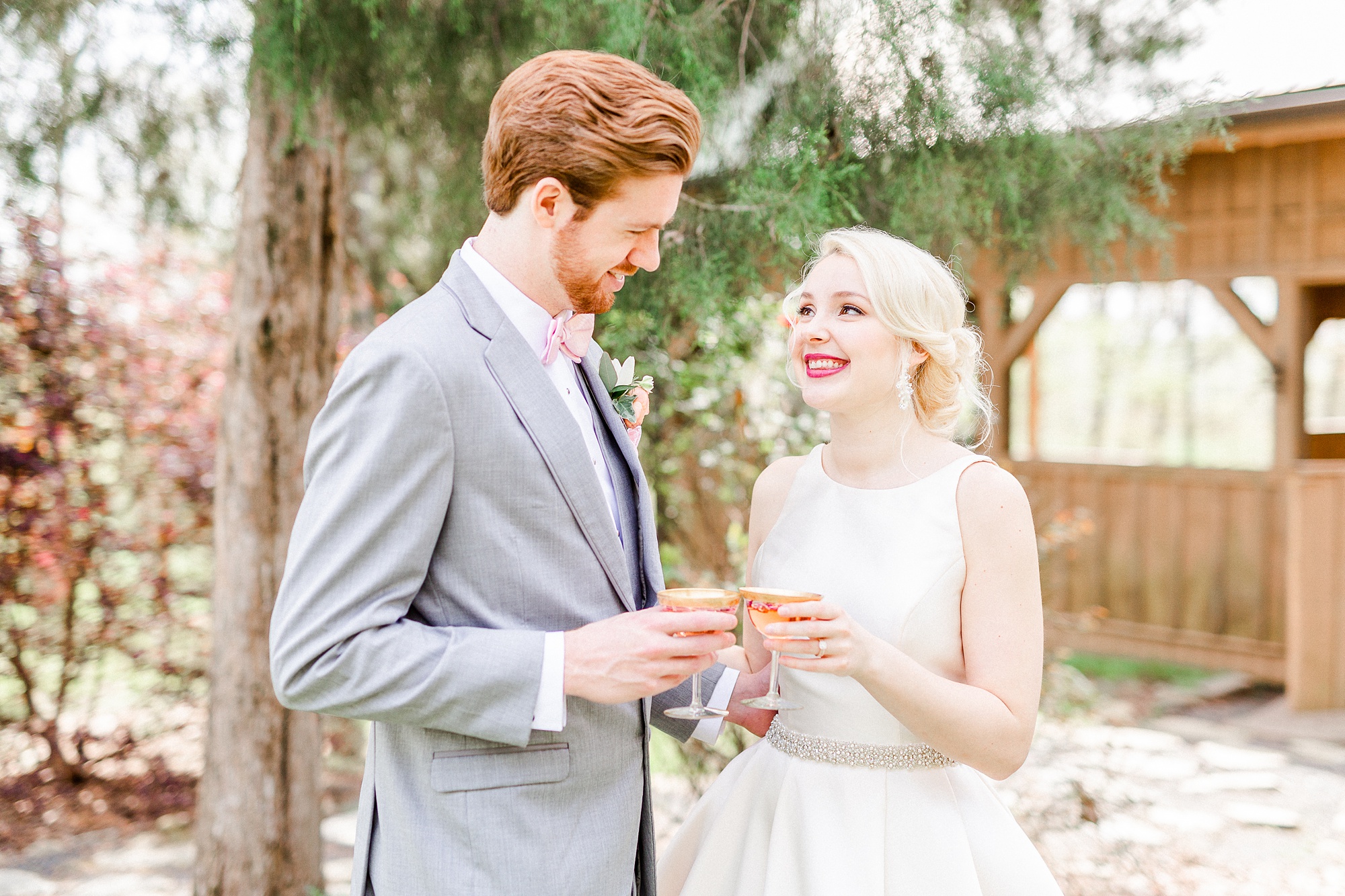 bride and groom toast signature cocktails for spring Carolina Country Weddings event