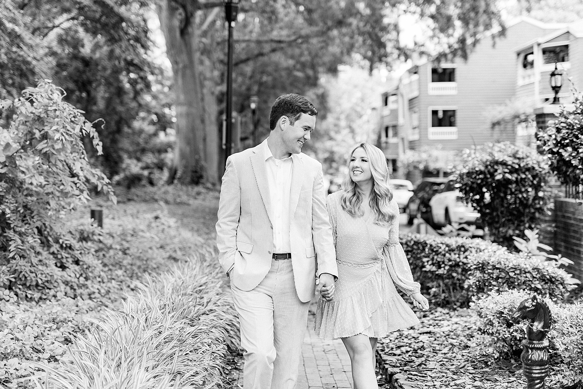 couple walks through uptown Charlotte