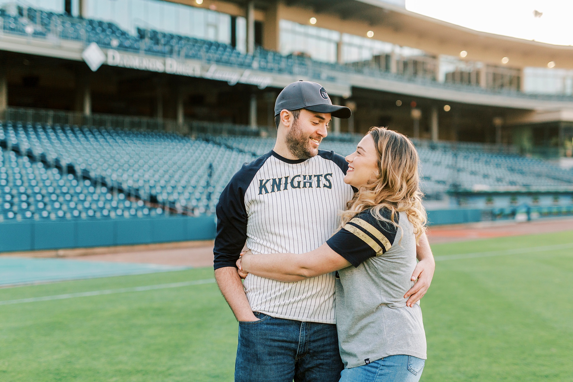 Truist Field engagement portraits on baseball diamond