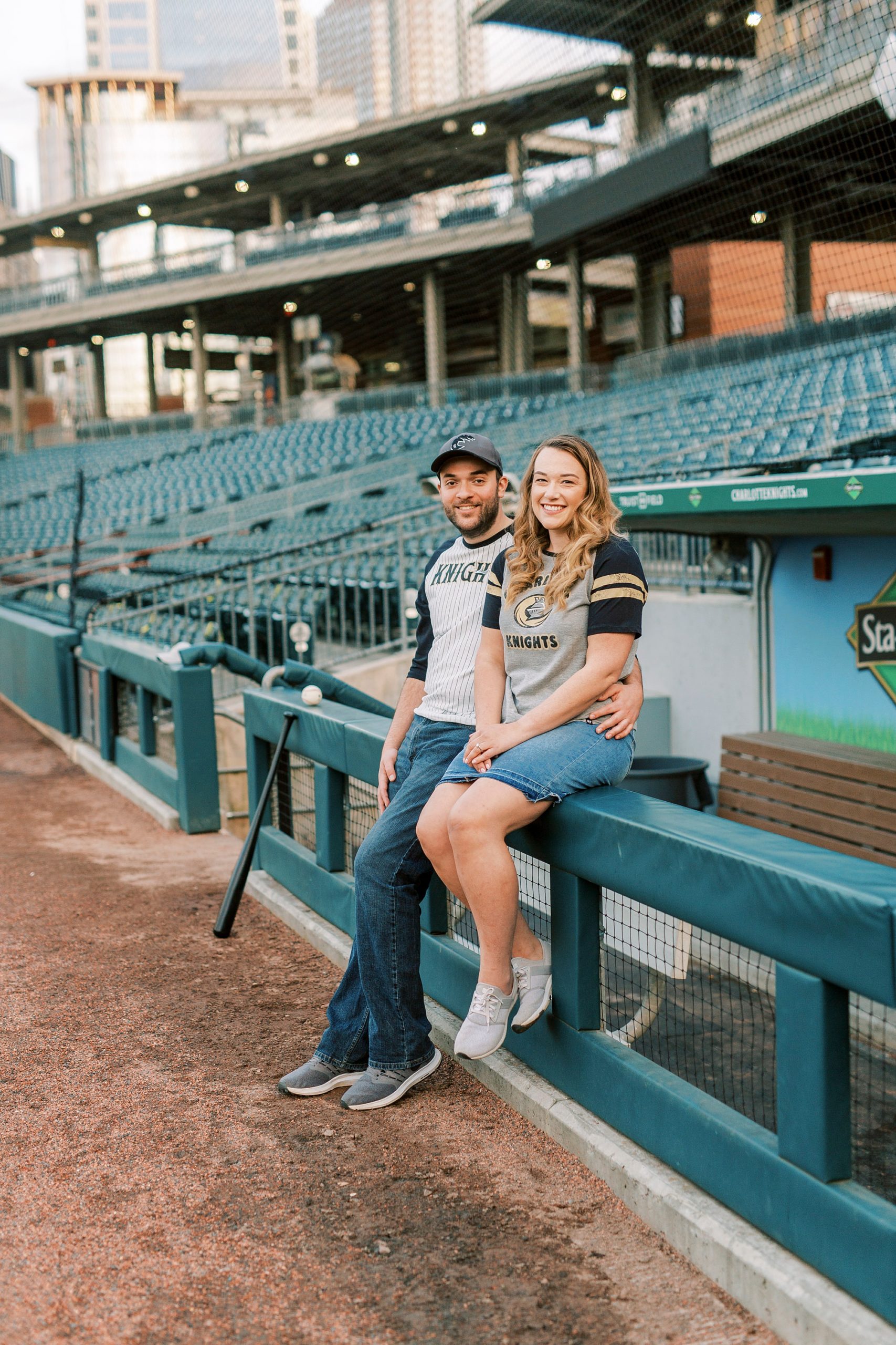Truist Field engagement portraits along dugout