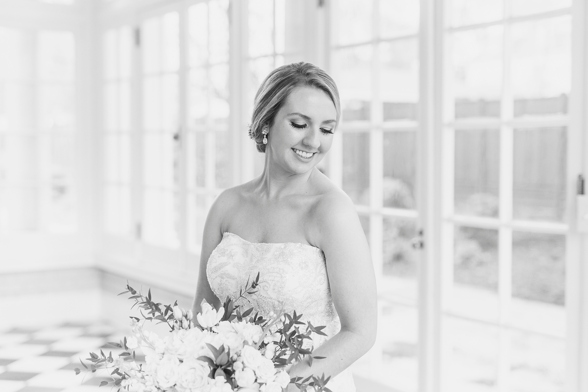 bride laughs looking over shoulder during cathedral veil bridal portraits