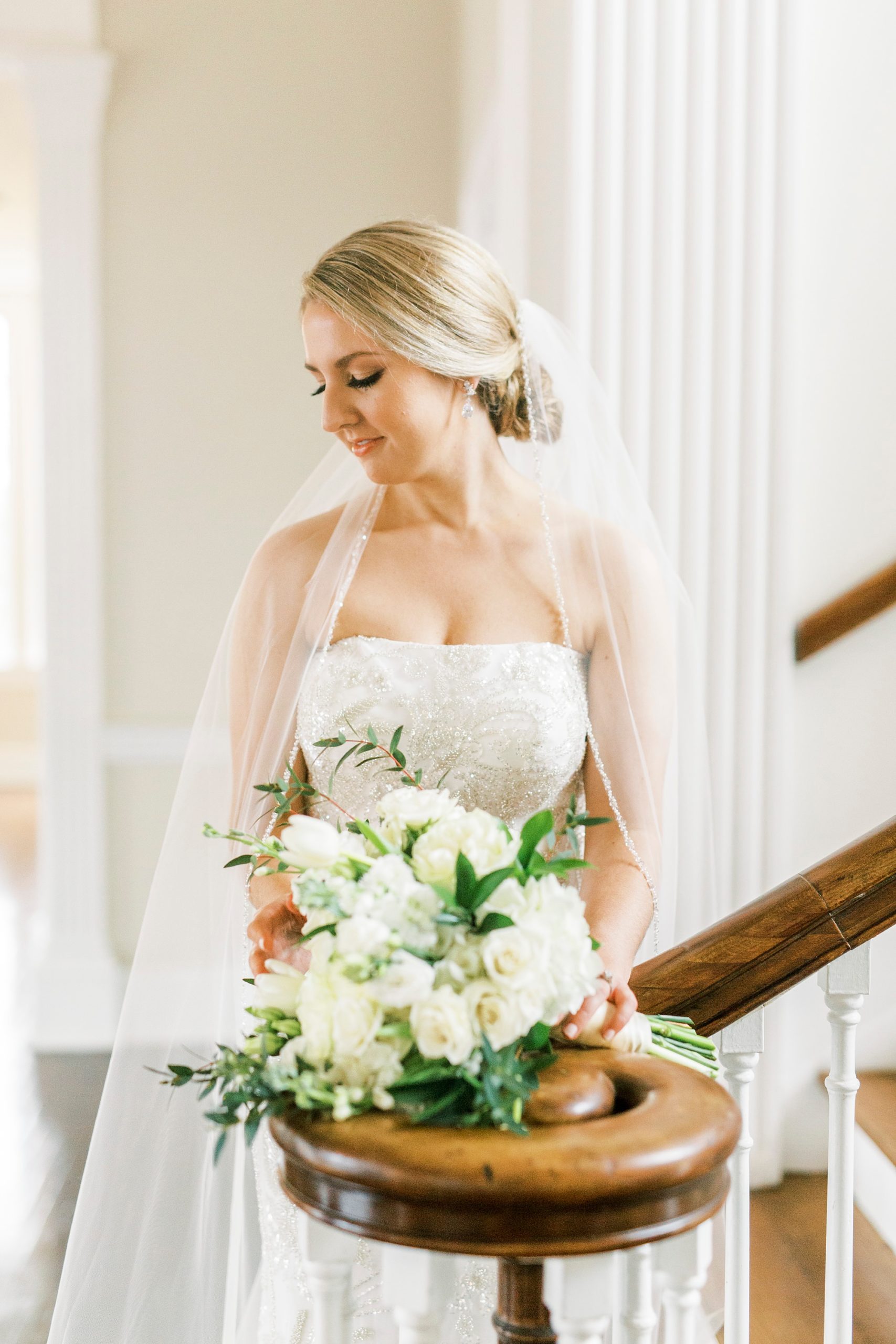 classic bridal portraits with cathedral veil around bride's shoulder