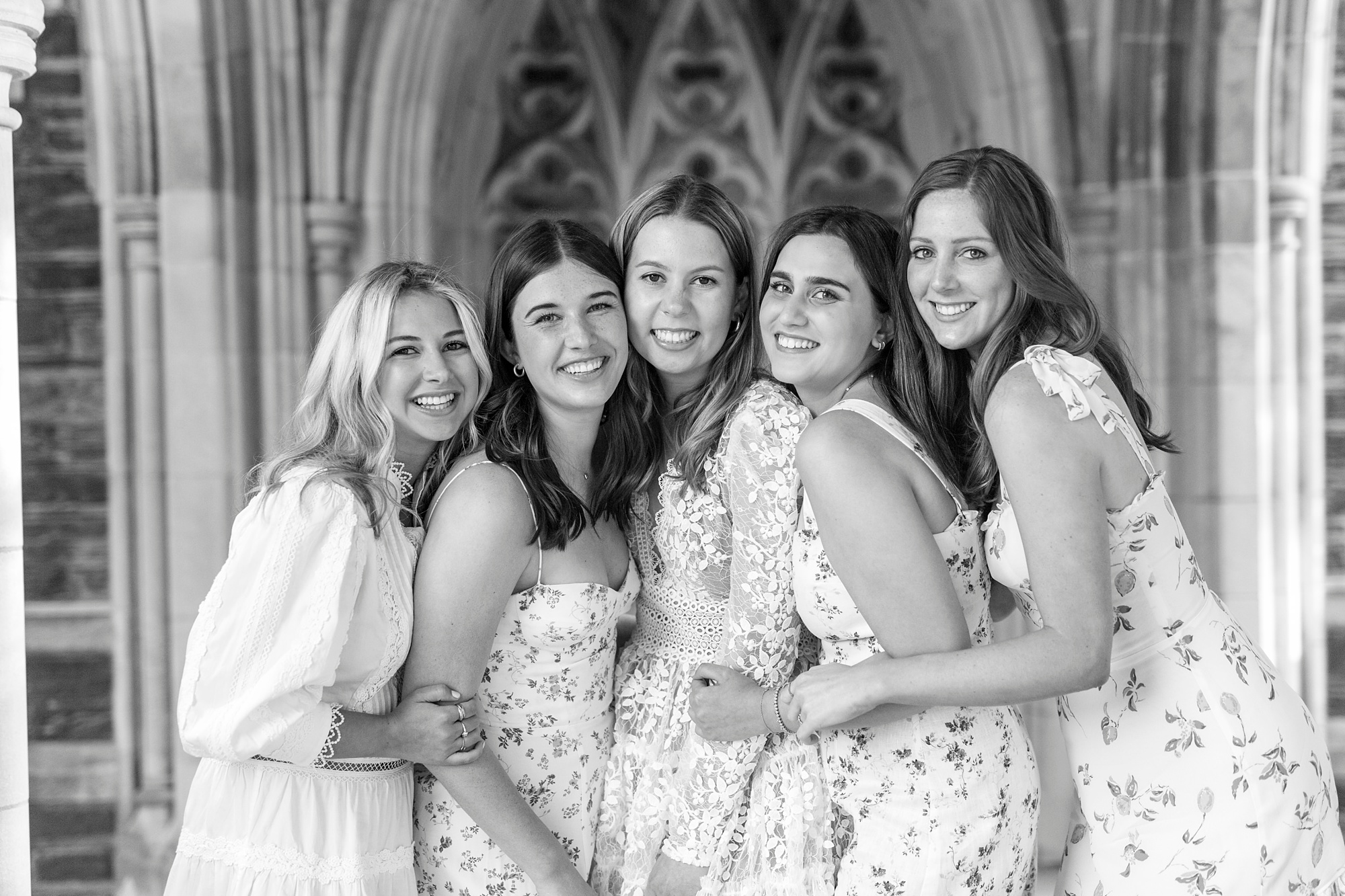 college seniors hug during portraits in Duke Chapel