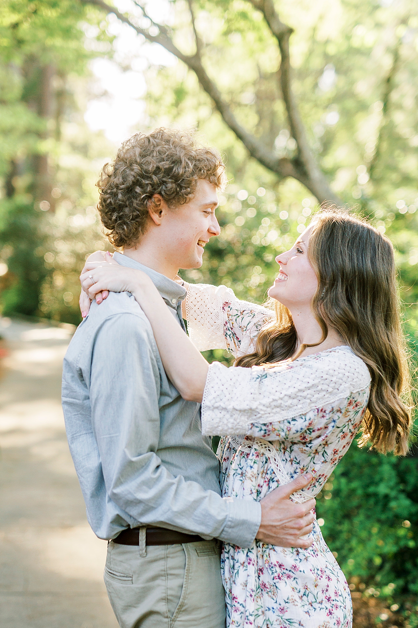 couple hugs on path in Glencairn Gardens