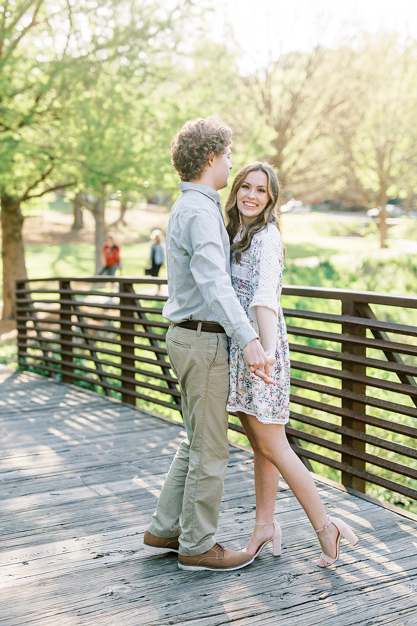 bride and groom hug on bridge in Rock Hill SC