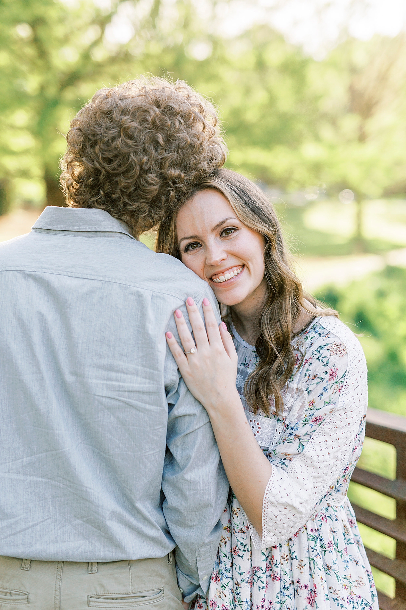 bride leans on groom's shoulder during Glencairn Gardens engagement session