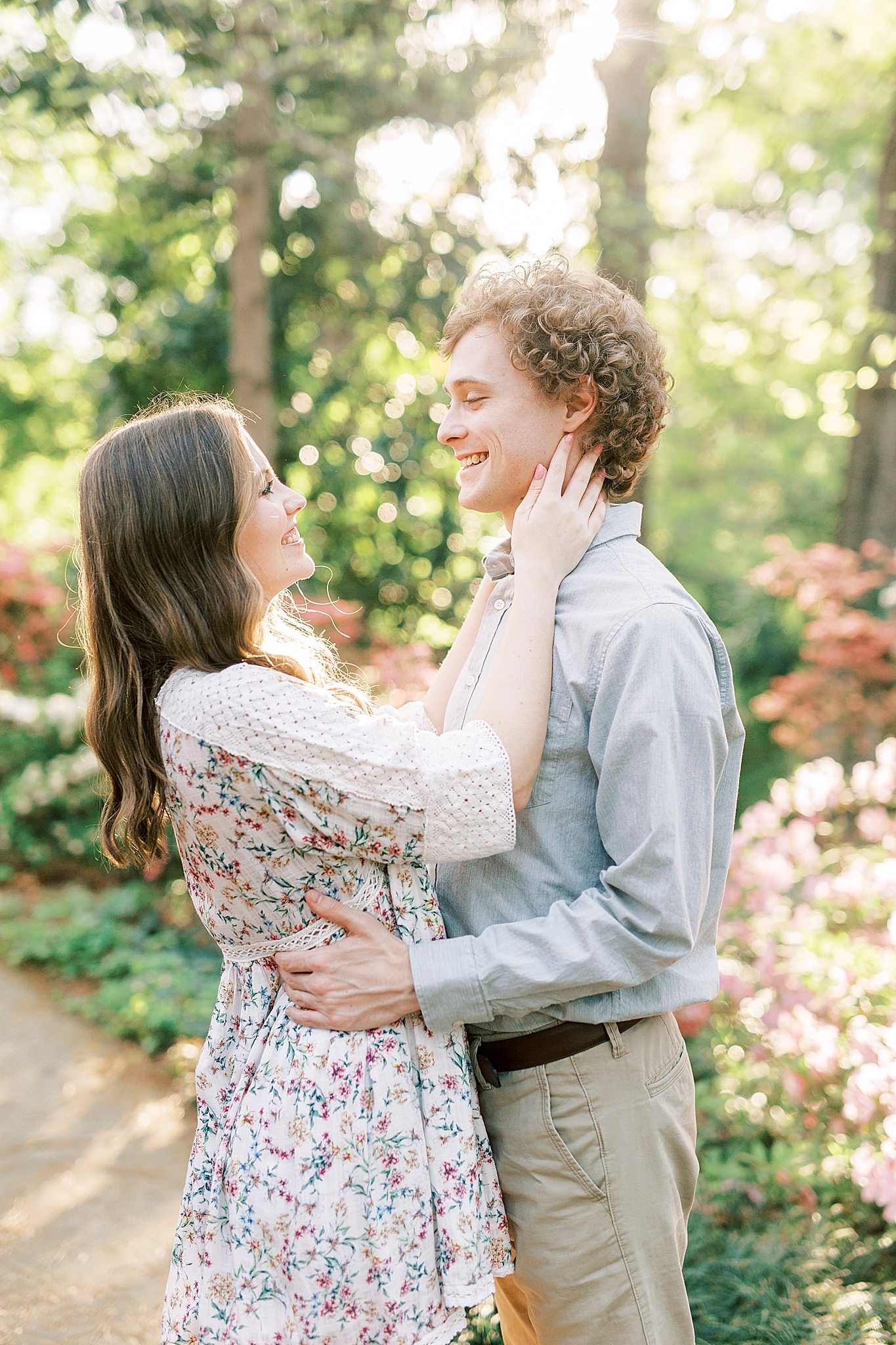 bride looks up at groom during Glencairn Gardens engagement session