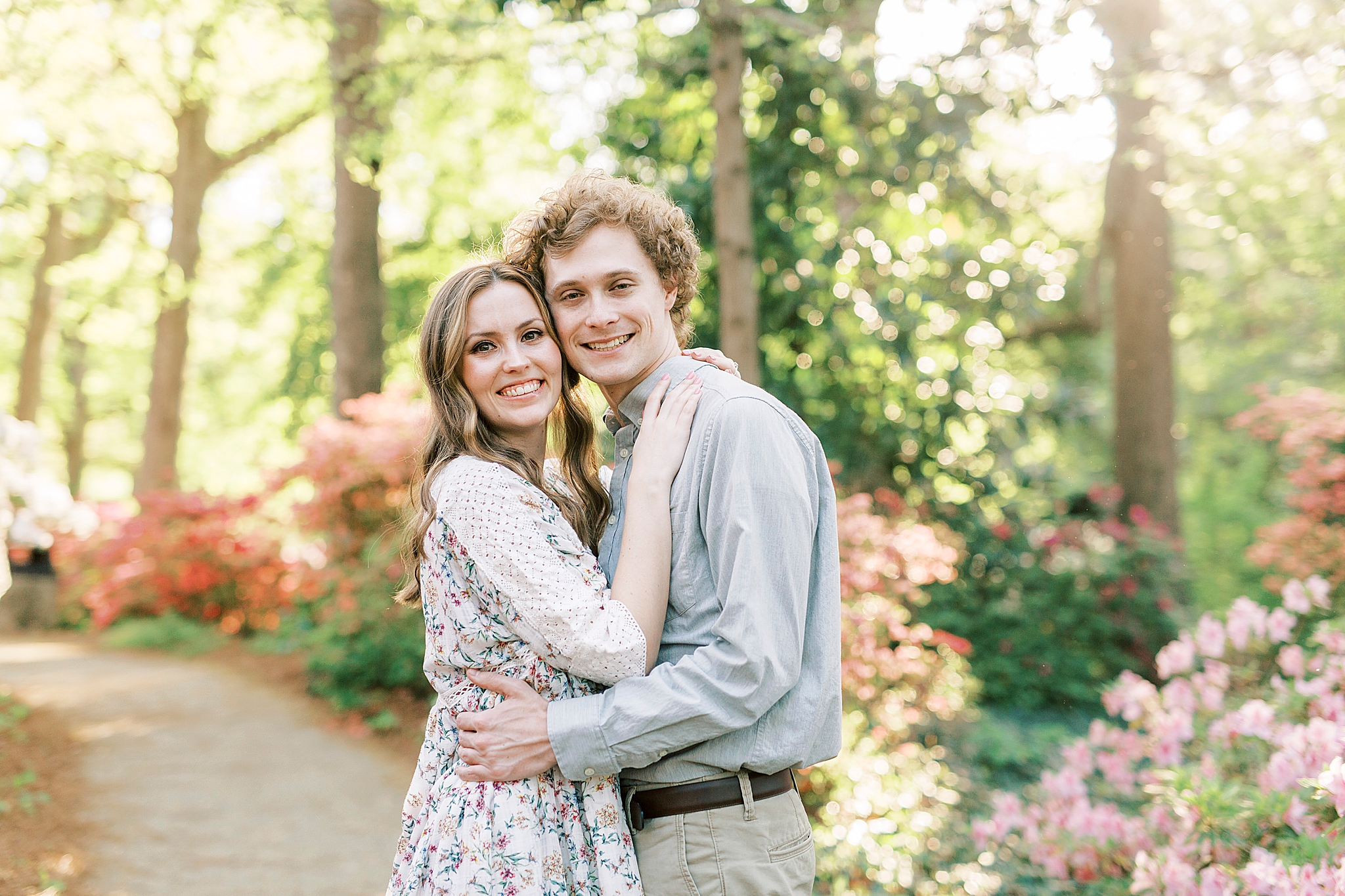 bride and groom hug on path in Glencairn Gardens