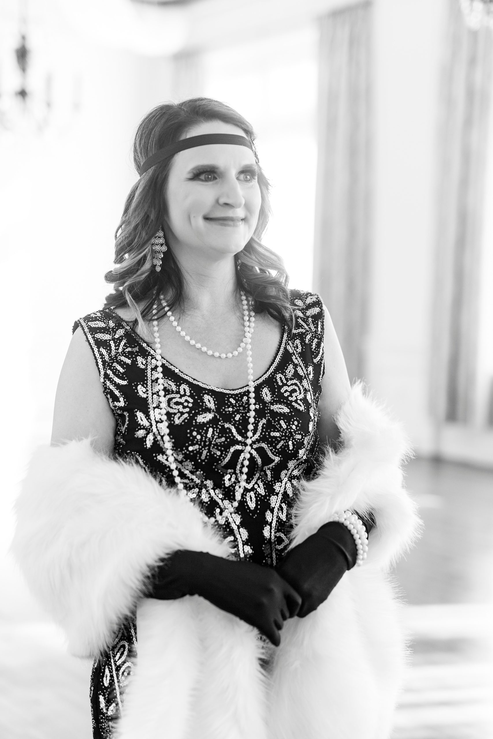 mom in 1920's outfit poses during Great Gatsby birthday party
