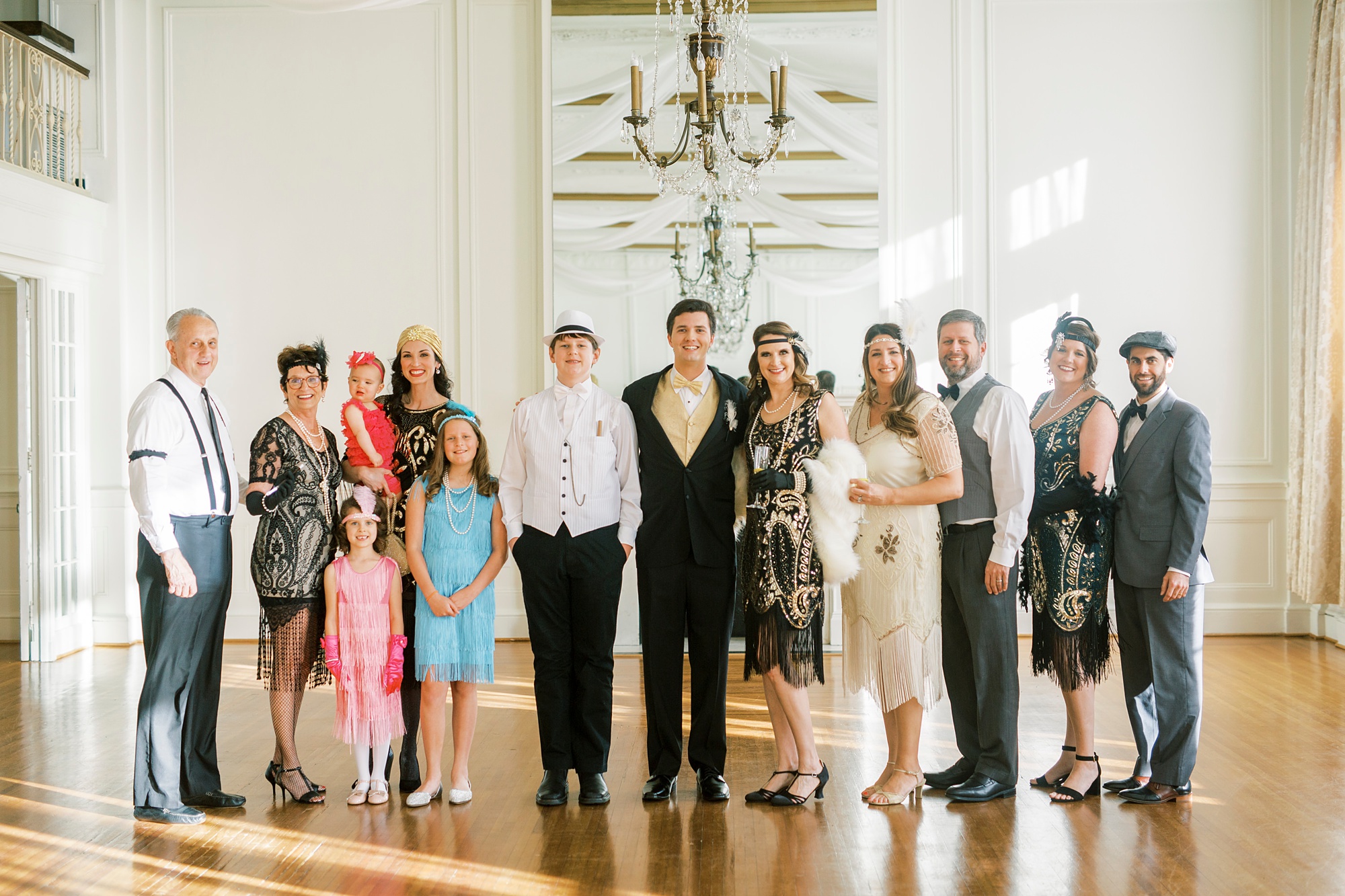 family poses with birthday guest during Hotel Concord birthday party