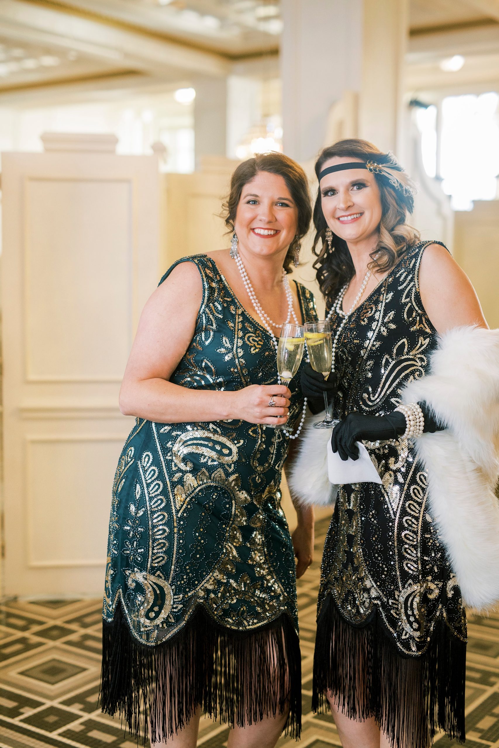 women in flapper dresses pose together during Great Gatsby birthday party