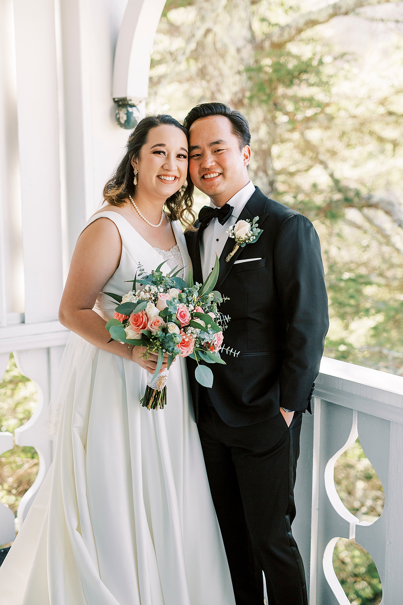 bride and groom pose on balcony at Green Park Inn