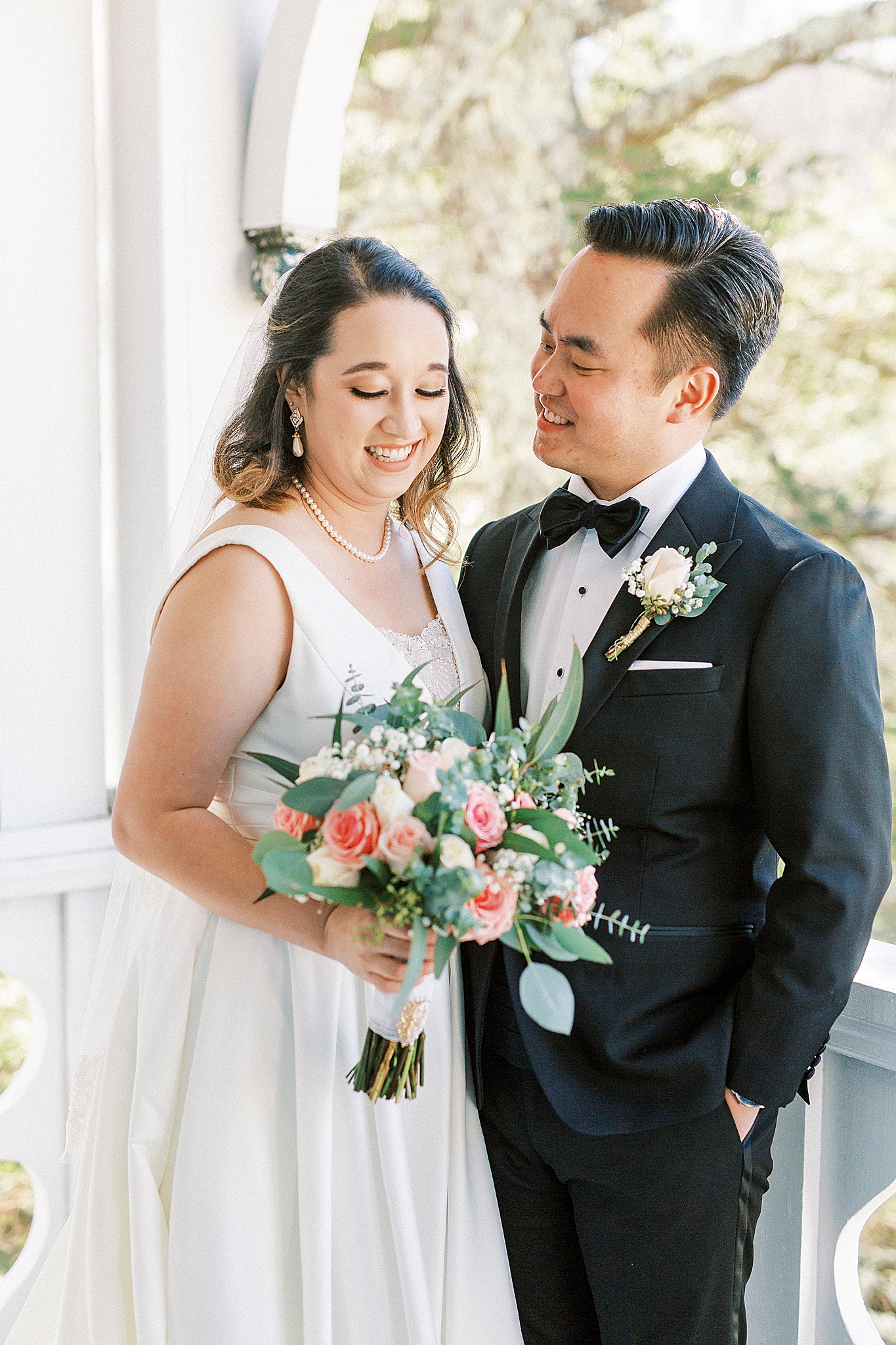 bride and groom laugh on Green Park Inn balcony