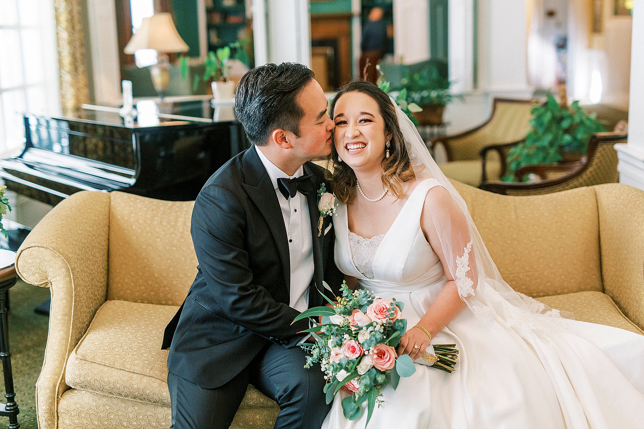 groom kisses bride's cheek at Green Park Inn