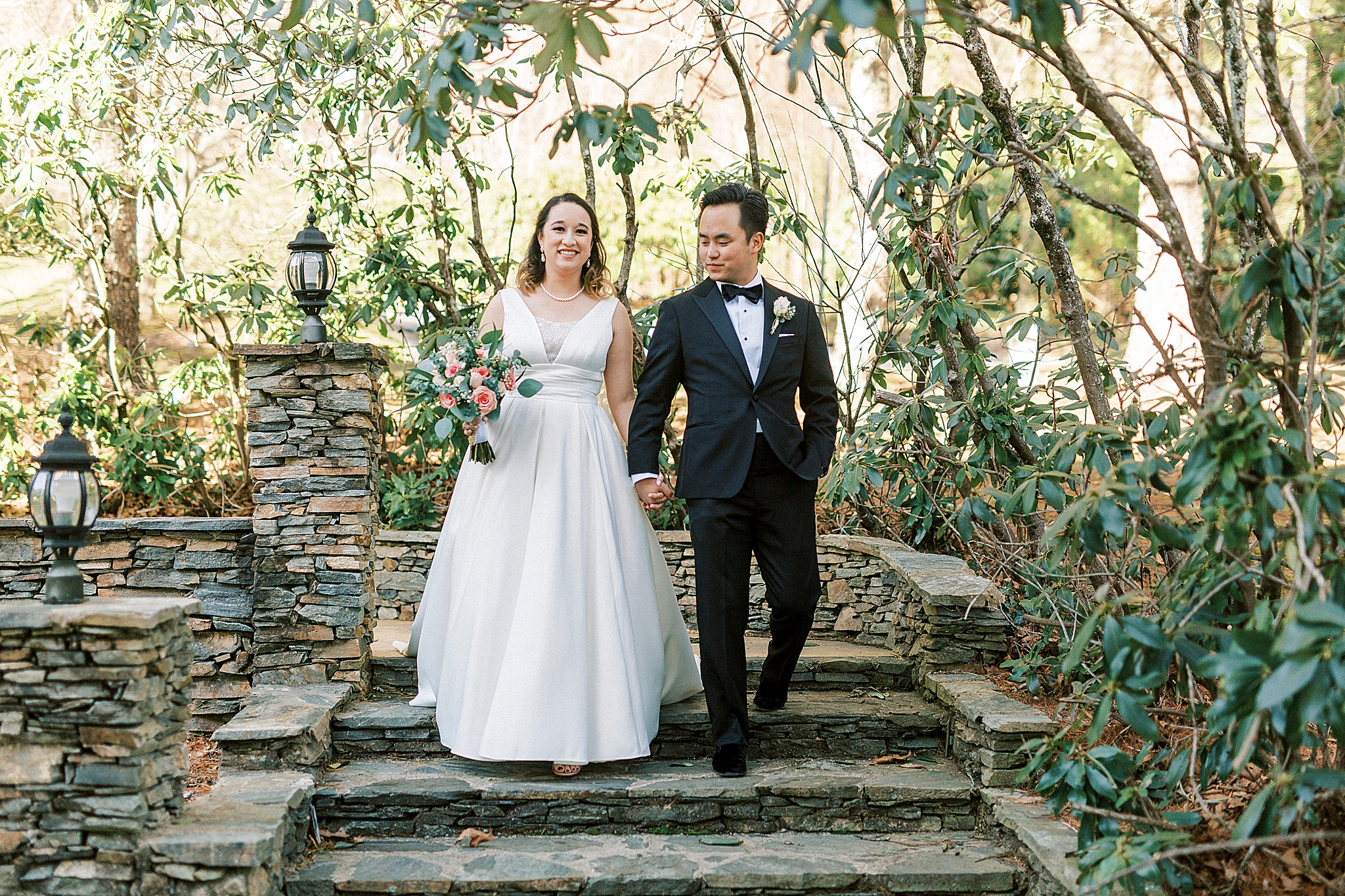 newlyweds walk down steps at Green Park Inn