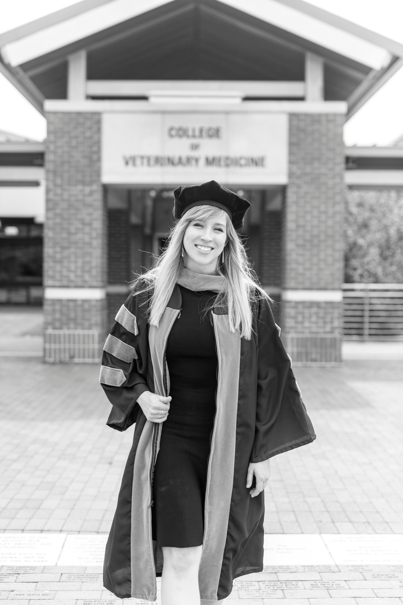 graduate walks outside Vet School during senior portraits