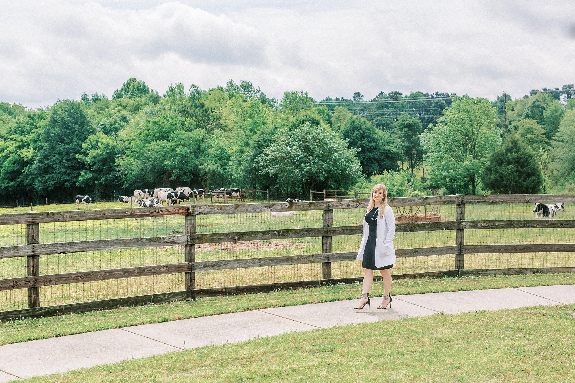 college grad walks outside field