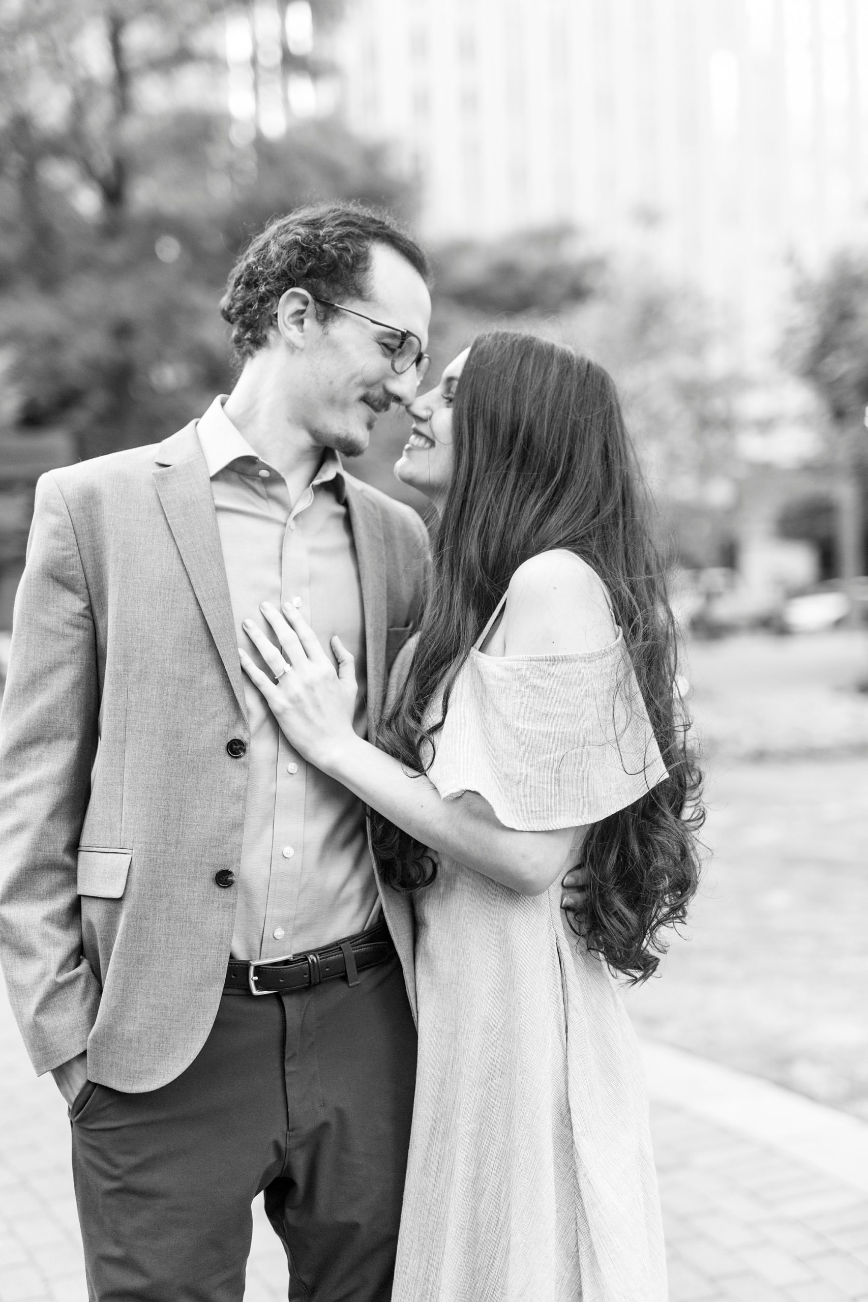 bride and groom hug during The Green Charlotte engagement session