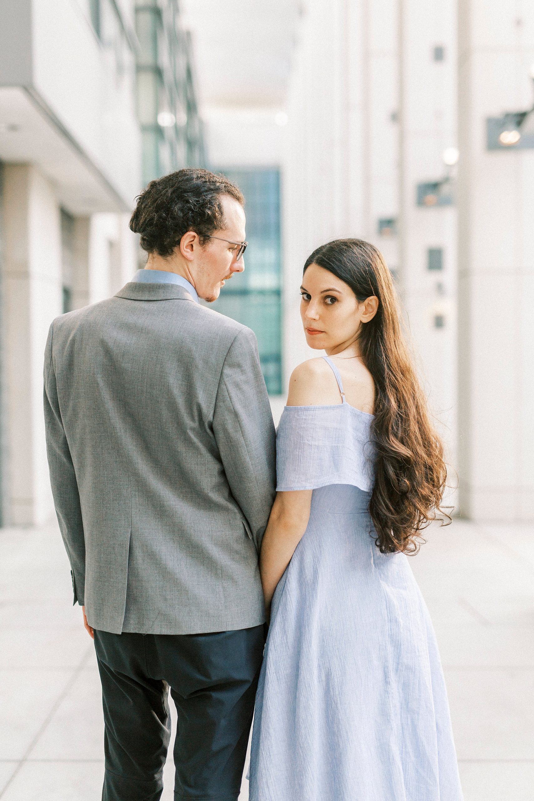 bride and groom walk through hallway at Charlotte Convention Center