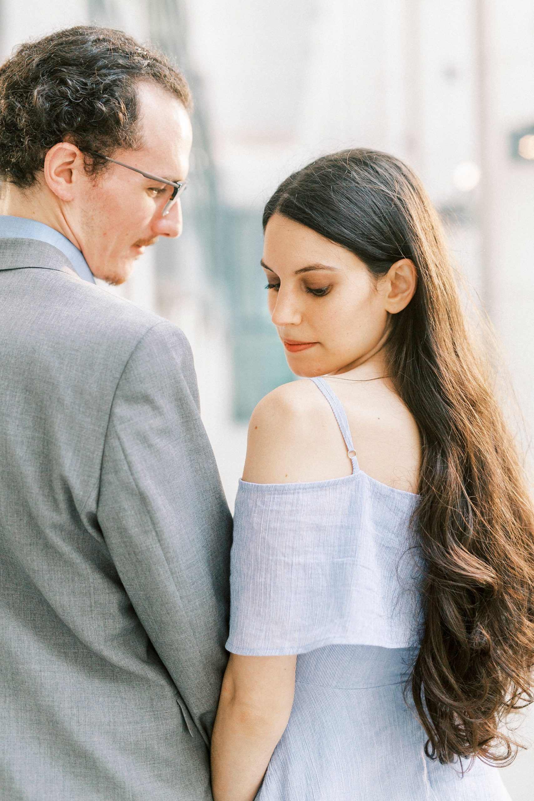 bride looks over shoulder in blue dress