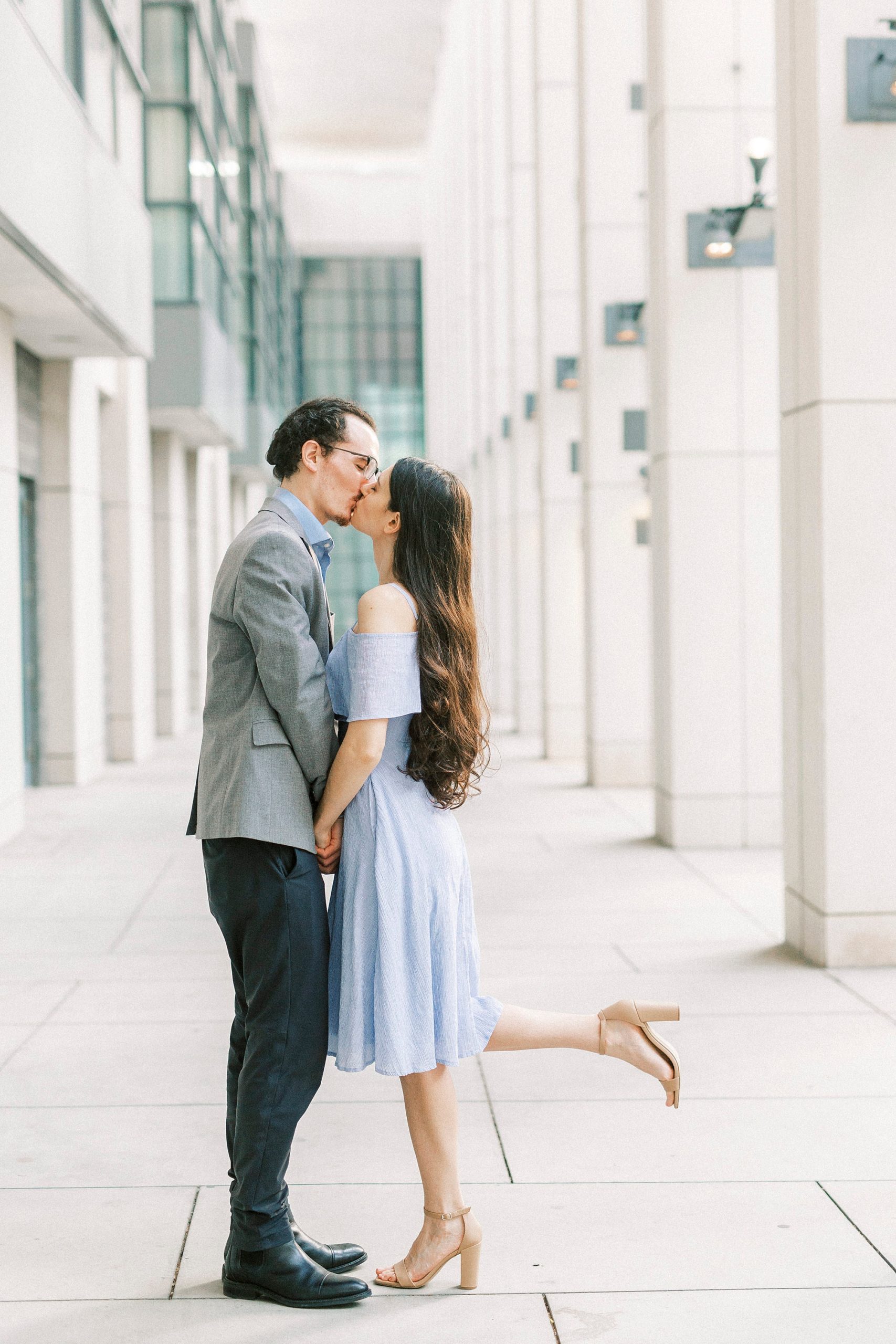 bride and groom kiss in hallway of Charlotte Convention Center