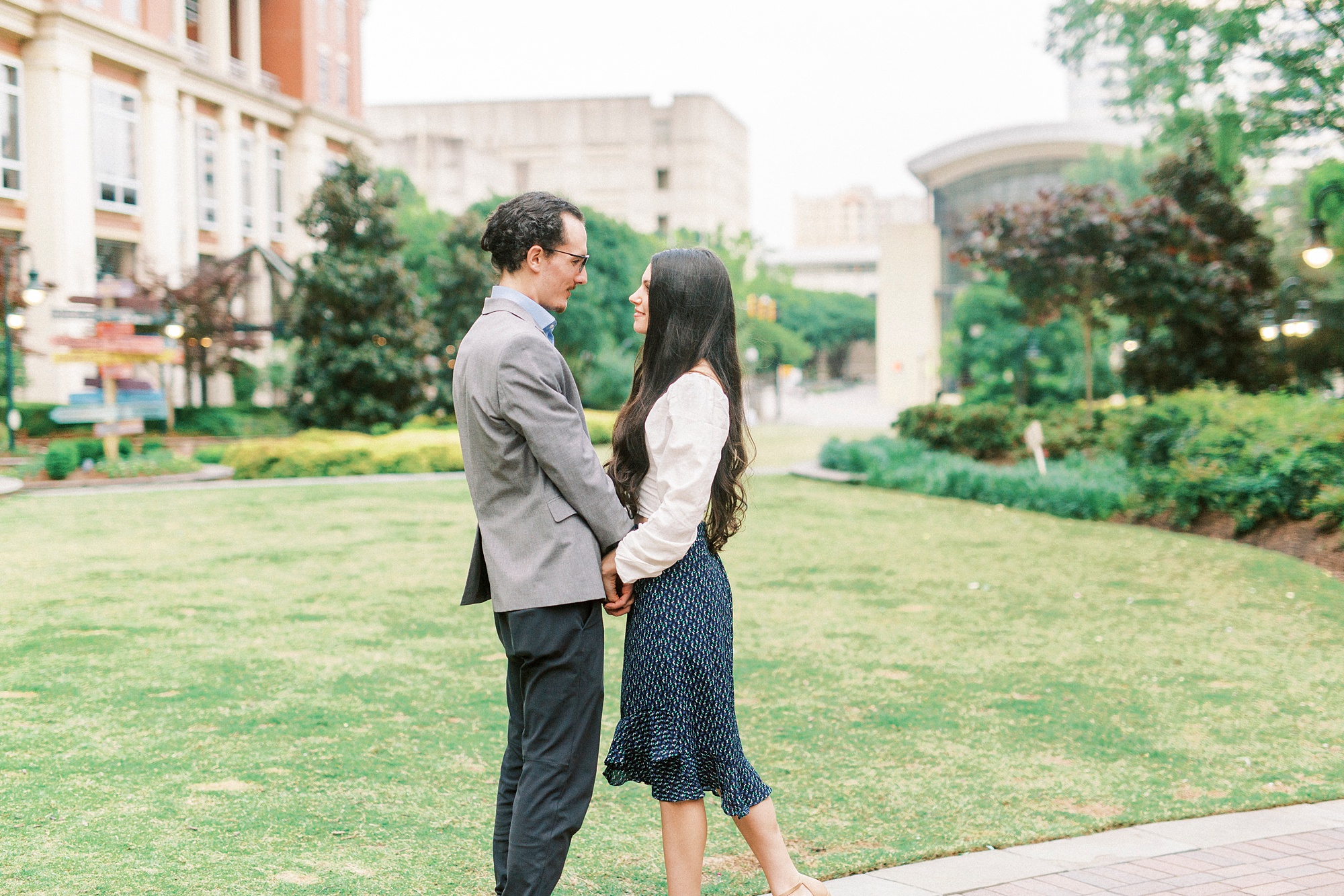 bride and groom pose outside The Mint Museum