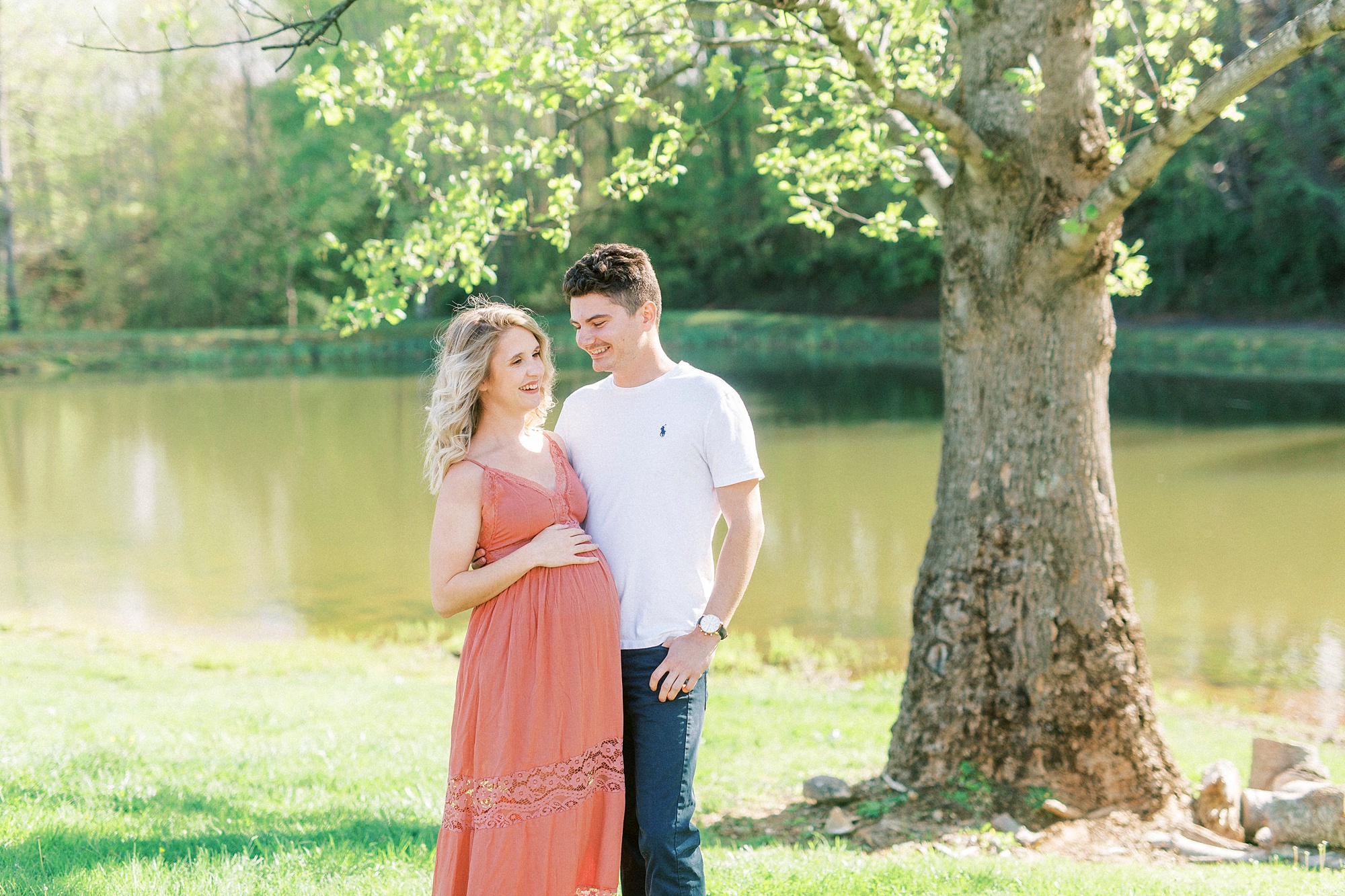 springtime matenrity portraits by lake in Mount Airy