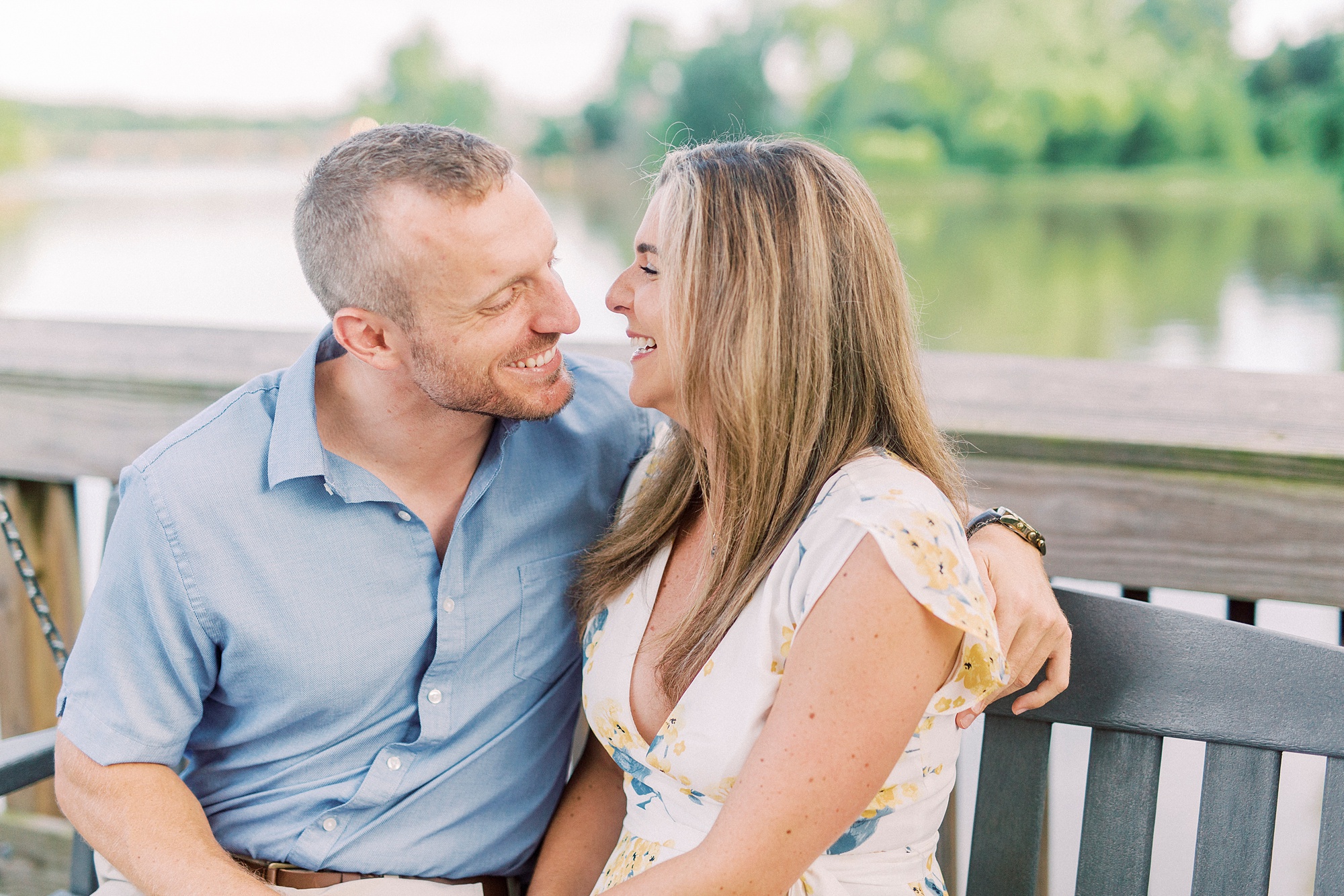 bride and groom laugh together during NC engagement photos