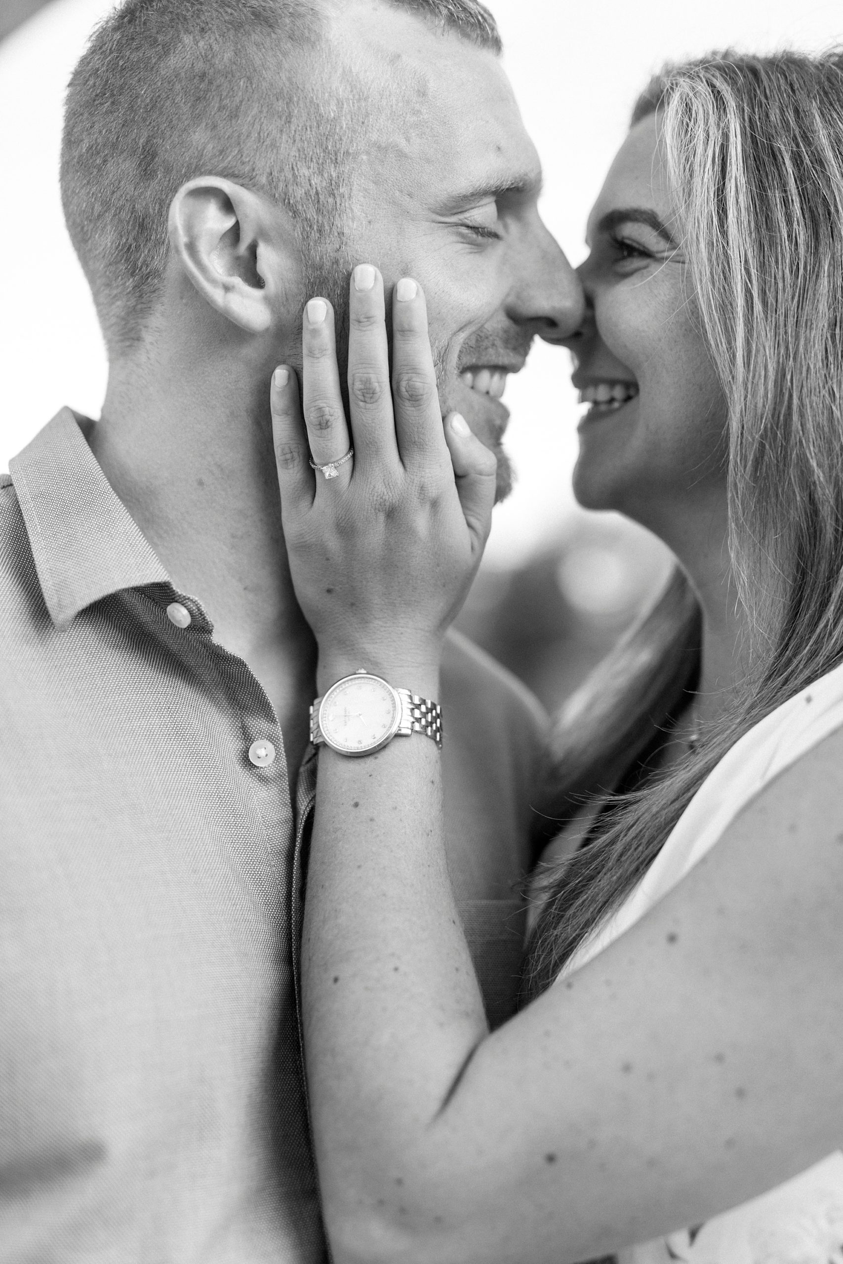 bride and groom lean in for kiss during Downtown Belmont engagement session