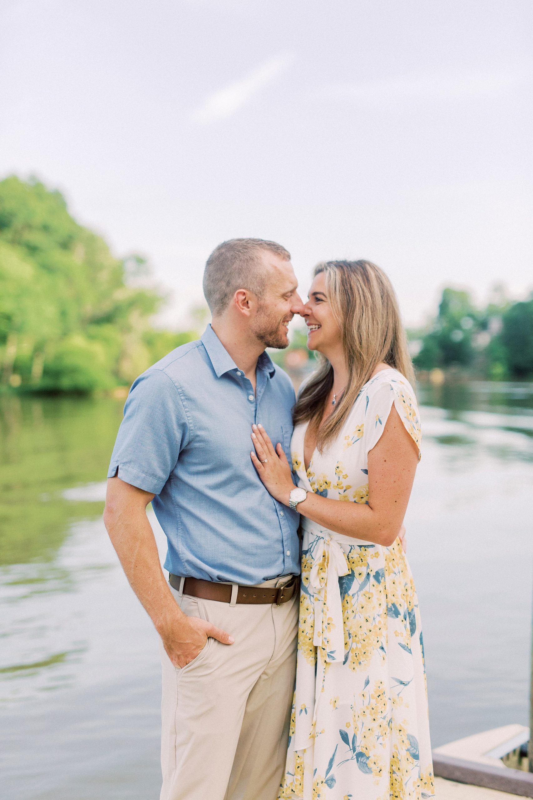 bride and groom stand nose to nose during Downtown Belmont engagement photos