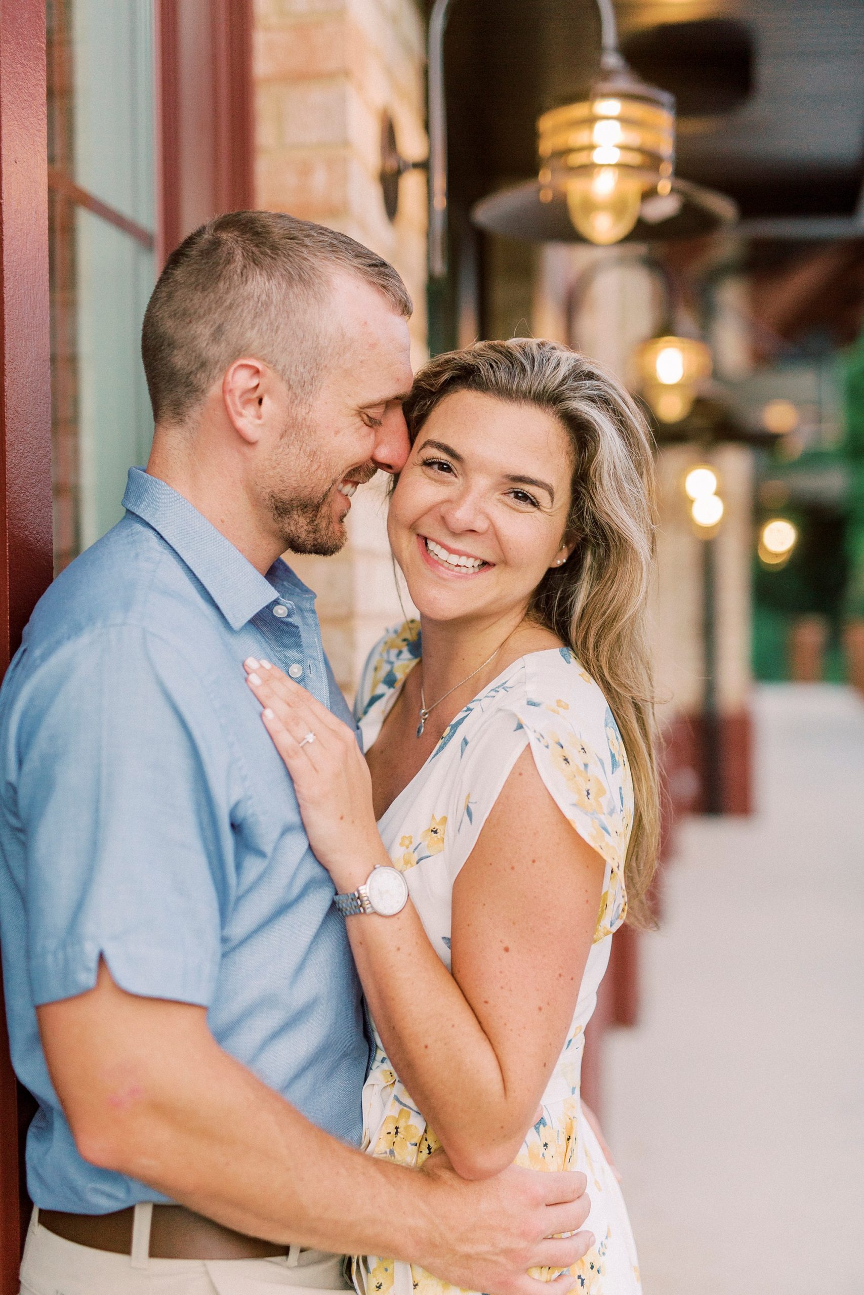 bride and groom lean against wall at Downtown Belmont restaurant