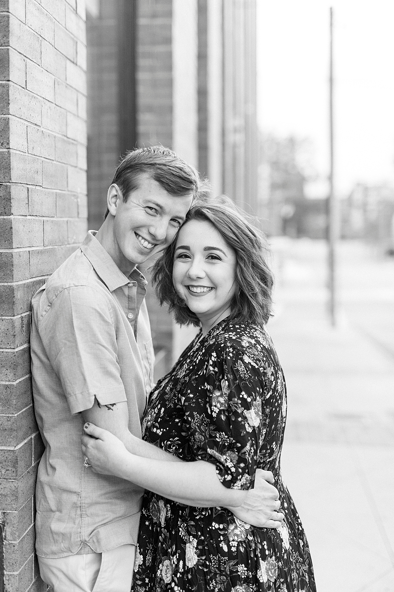 married couple hugs outside On Tap in Downtown Mooresville