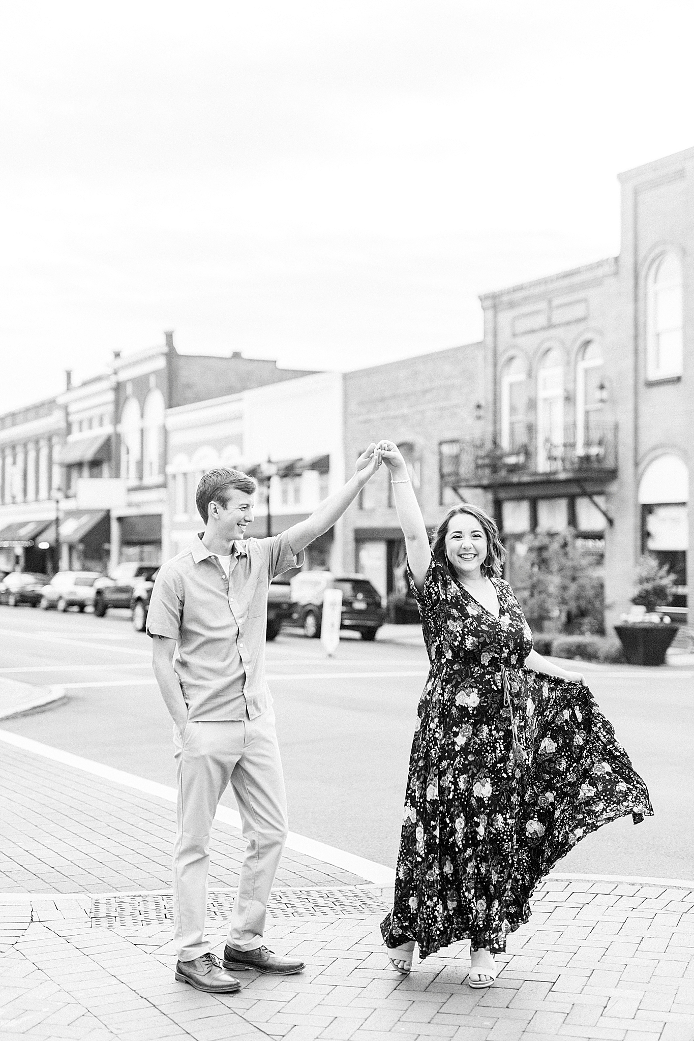 husband twirls wife during anniversary photos