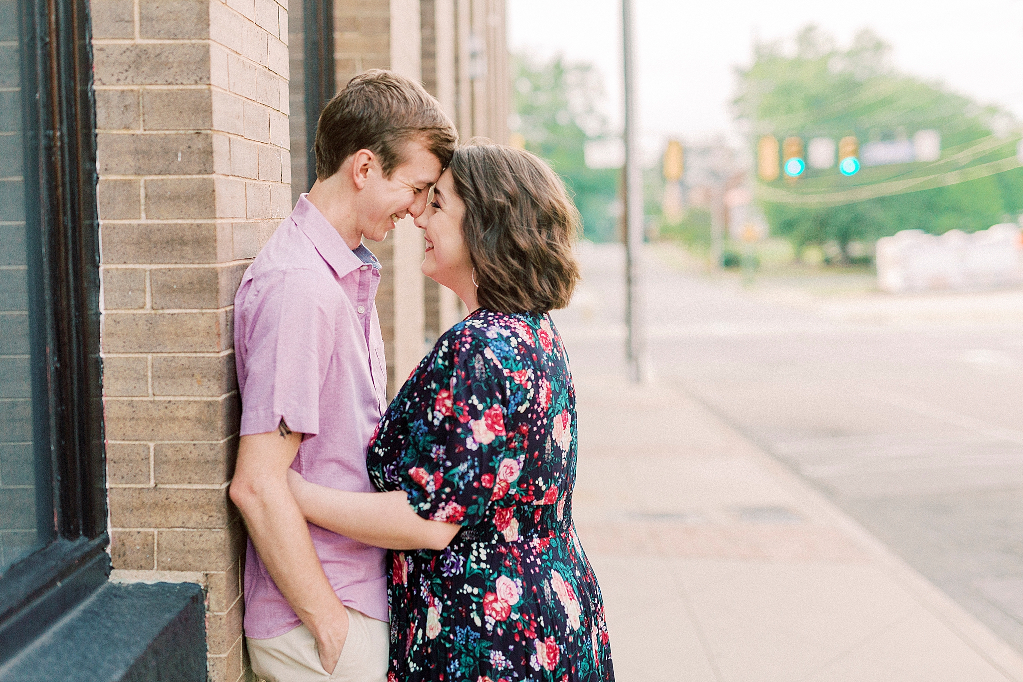 wife leans against husband during anniversary photos