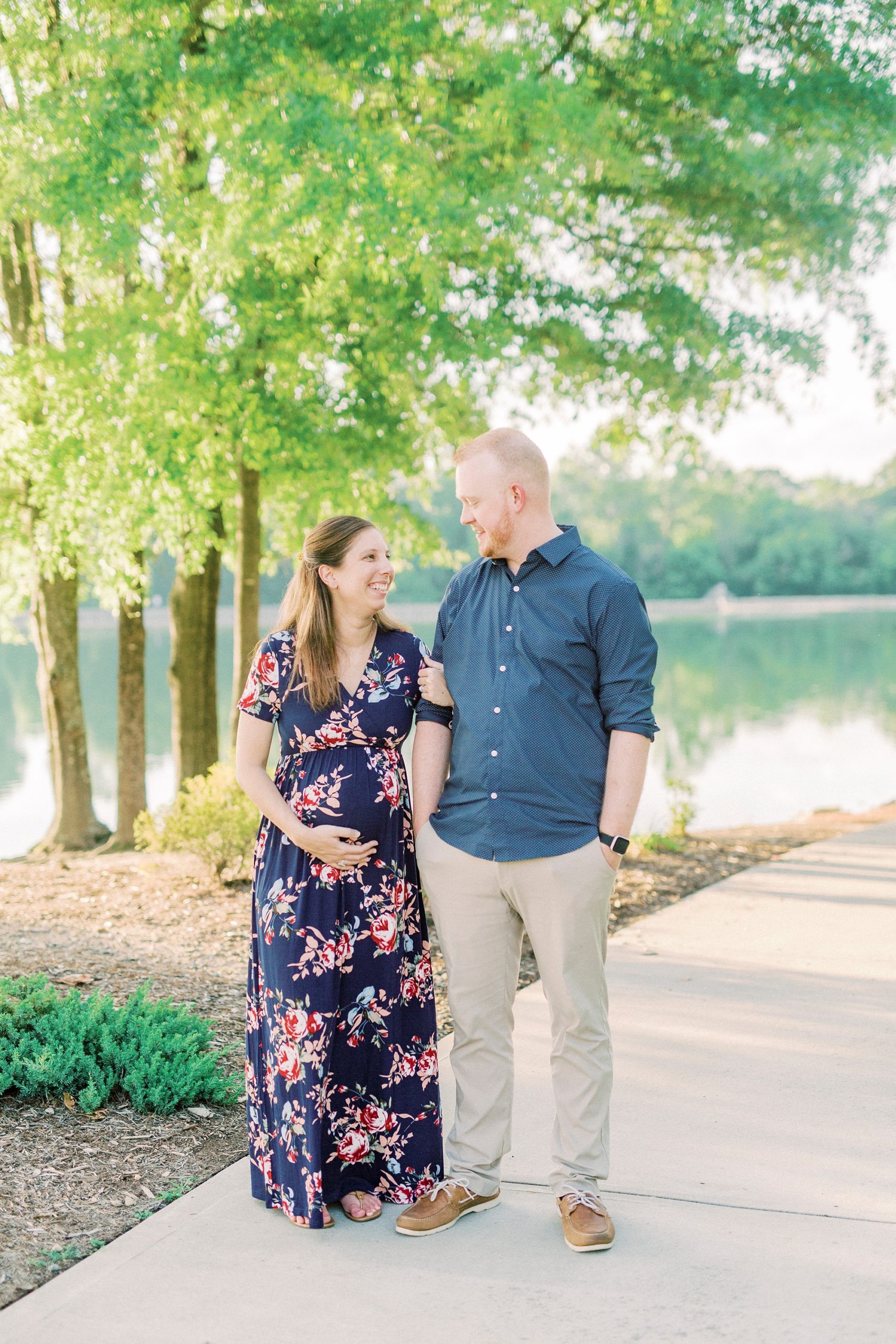 husband and wife look at each other pier in Gastonia NC