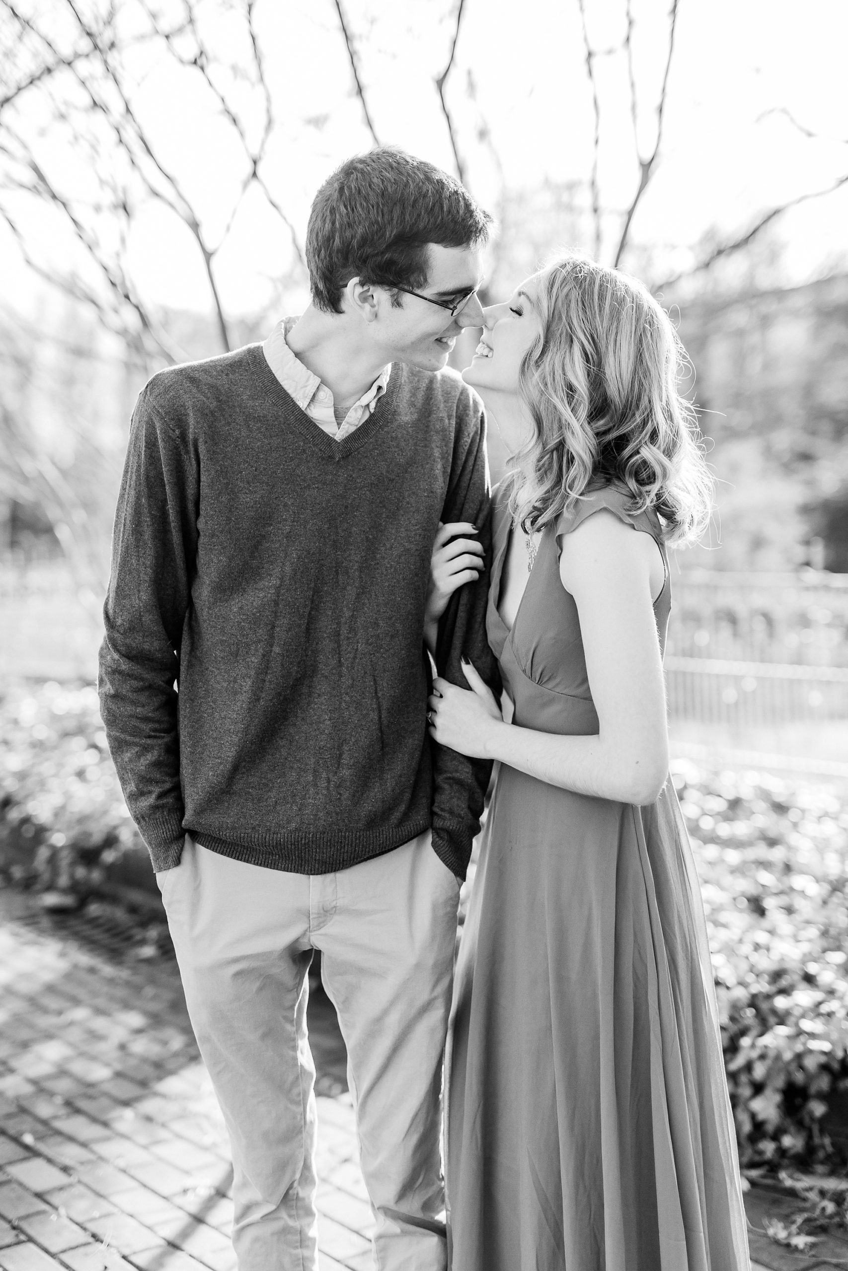 bride and groom touch noses during 1812 Hitching Post engagement session