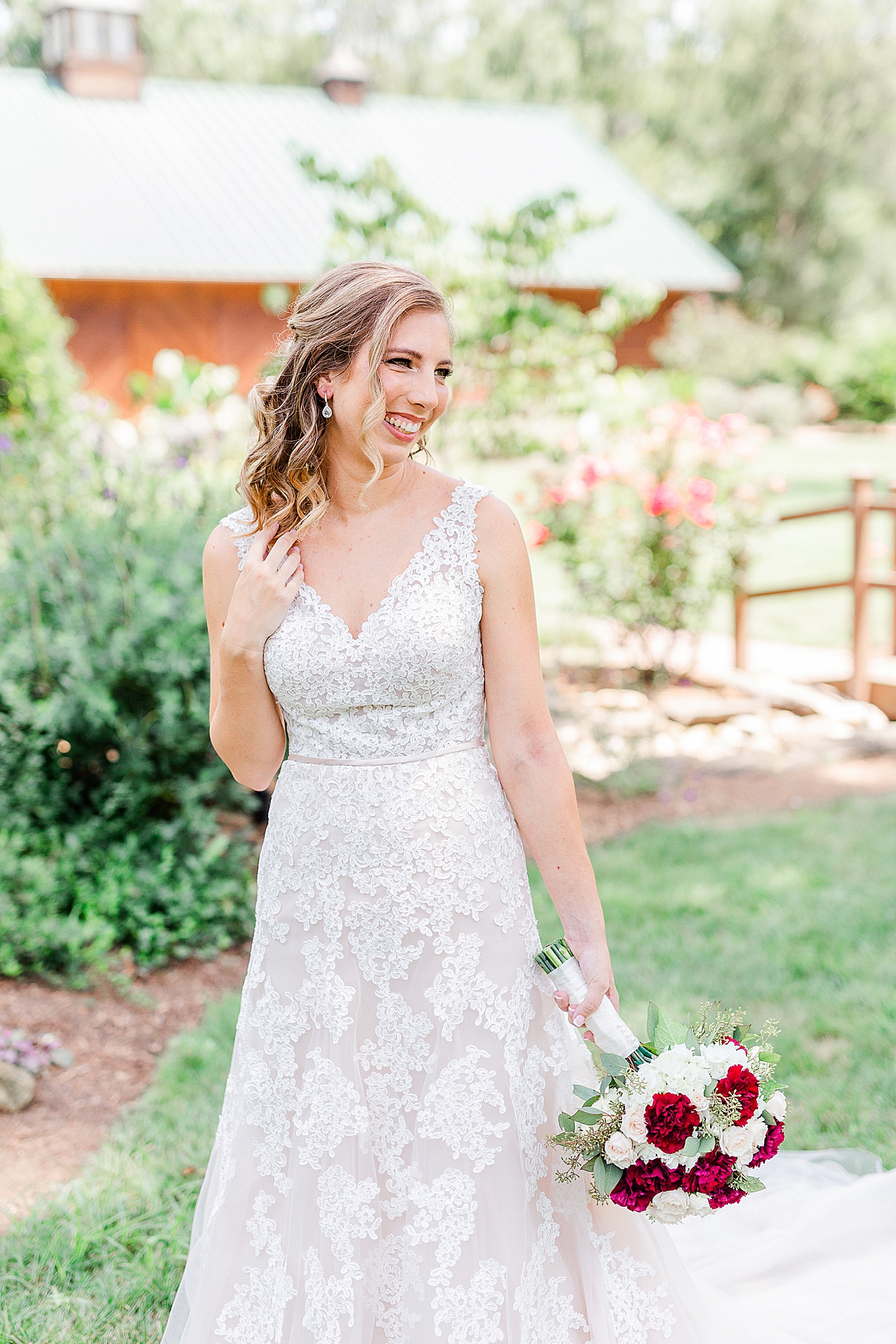 bride holds hair over shoulder during Alexander Homestead bridal portraits