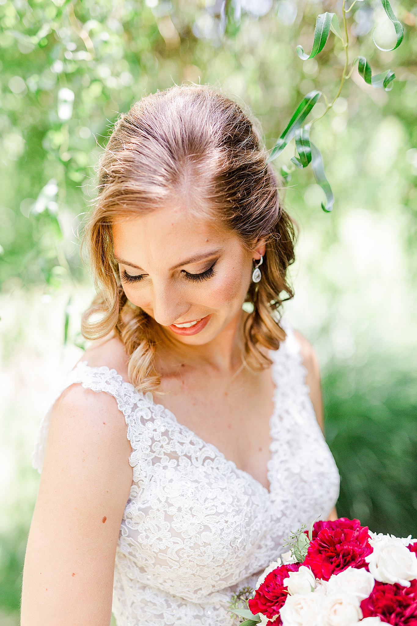 bride smiles looking over shoulder during Alexander Homestead bridal portraits